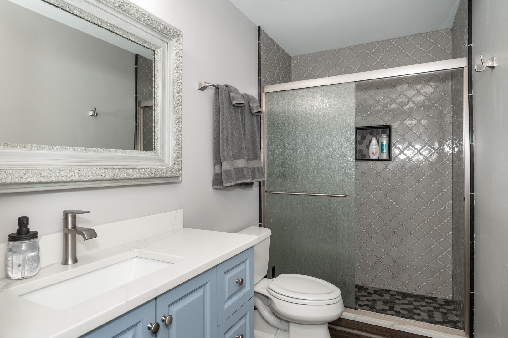 Apt 3 – The full bath includes a stylish single vanity & glass shower