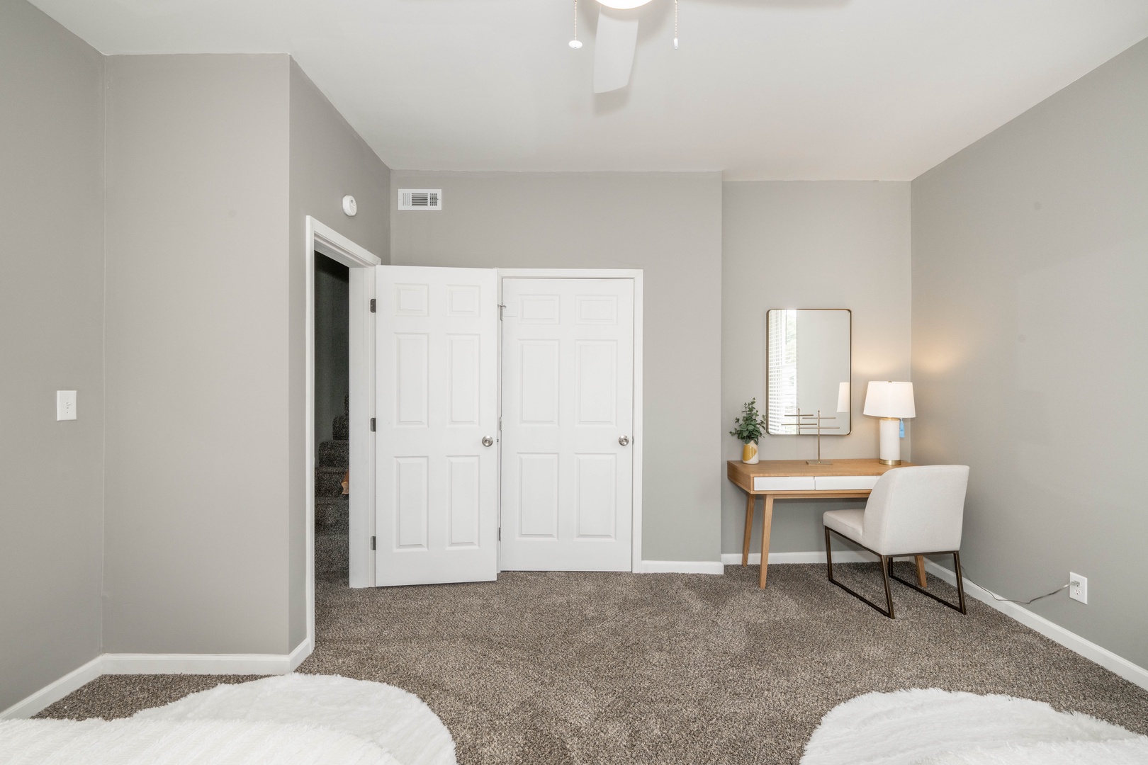 The final 2nd floor bedroom offers a pair of full-sized beds & vanity/desk space