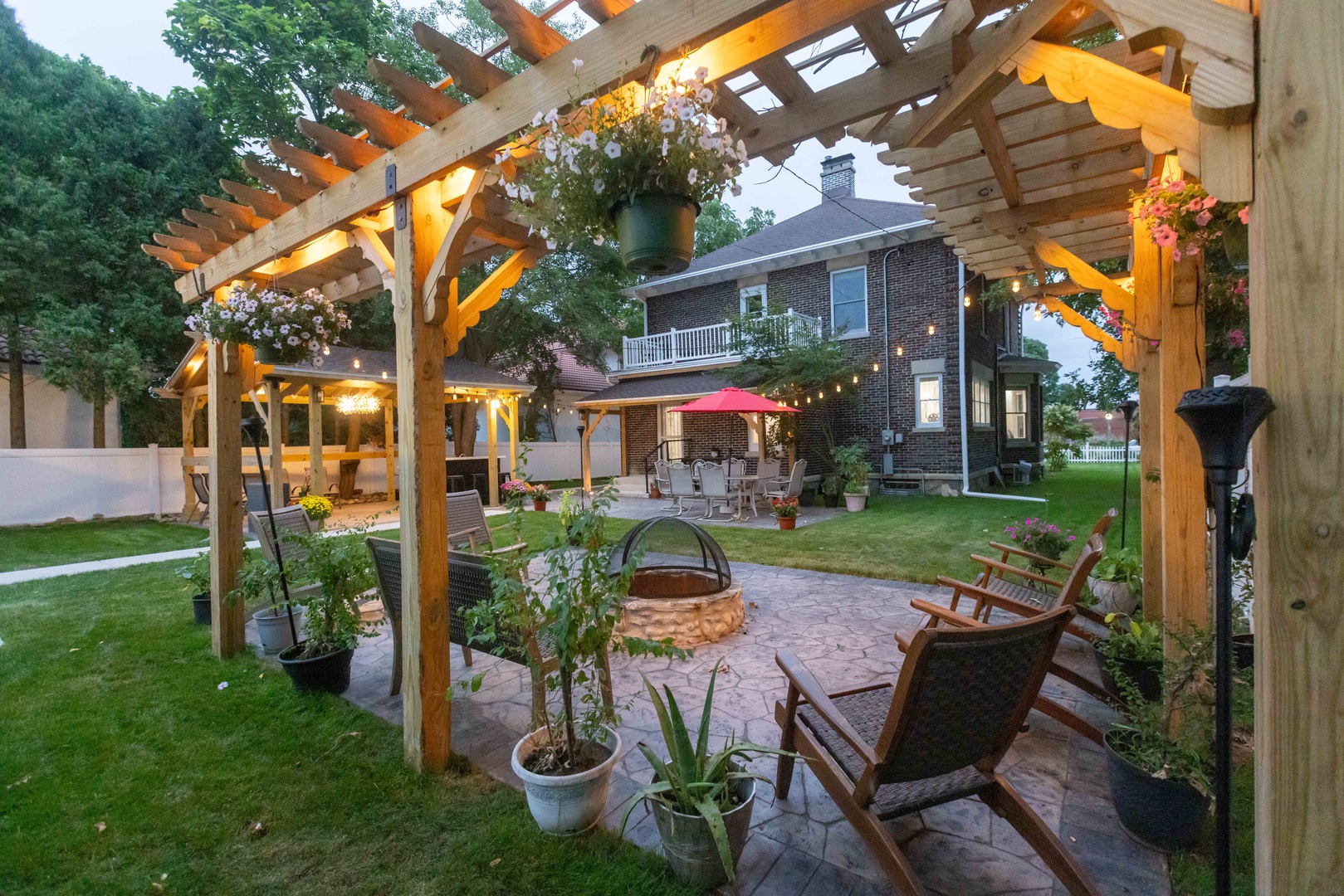 The large back yard offers tons of space for relaxation, dining, & play
