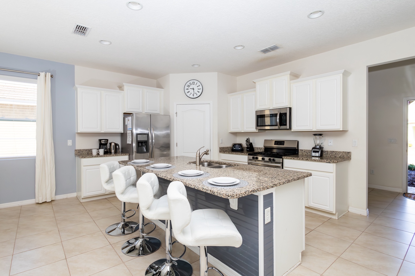 Sip morning coffee or grab a bite at the kitchen counter, with space for 4