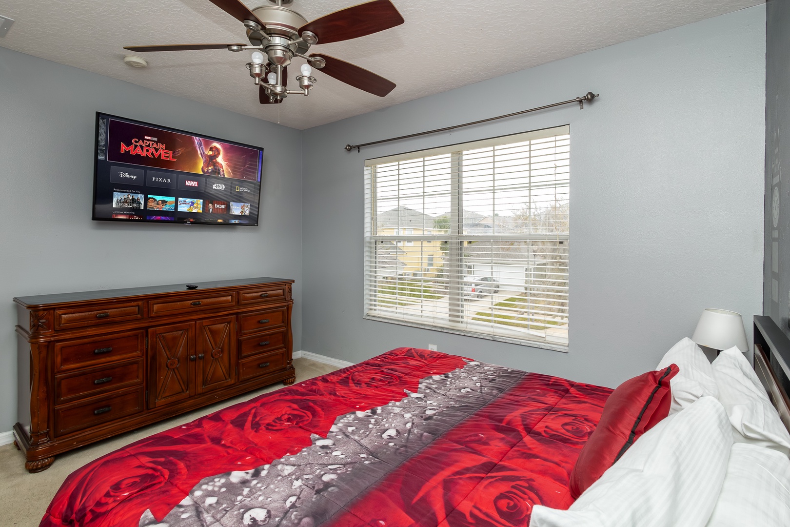 This 2nd King bedroom with a Peter Pan theme and a ceiling fan & smart TV