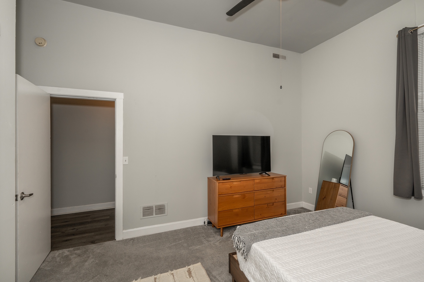 Get away from it all in your Queen Bedroom with Smart TV and Ceiling Fan