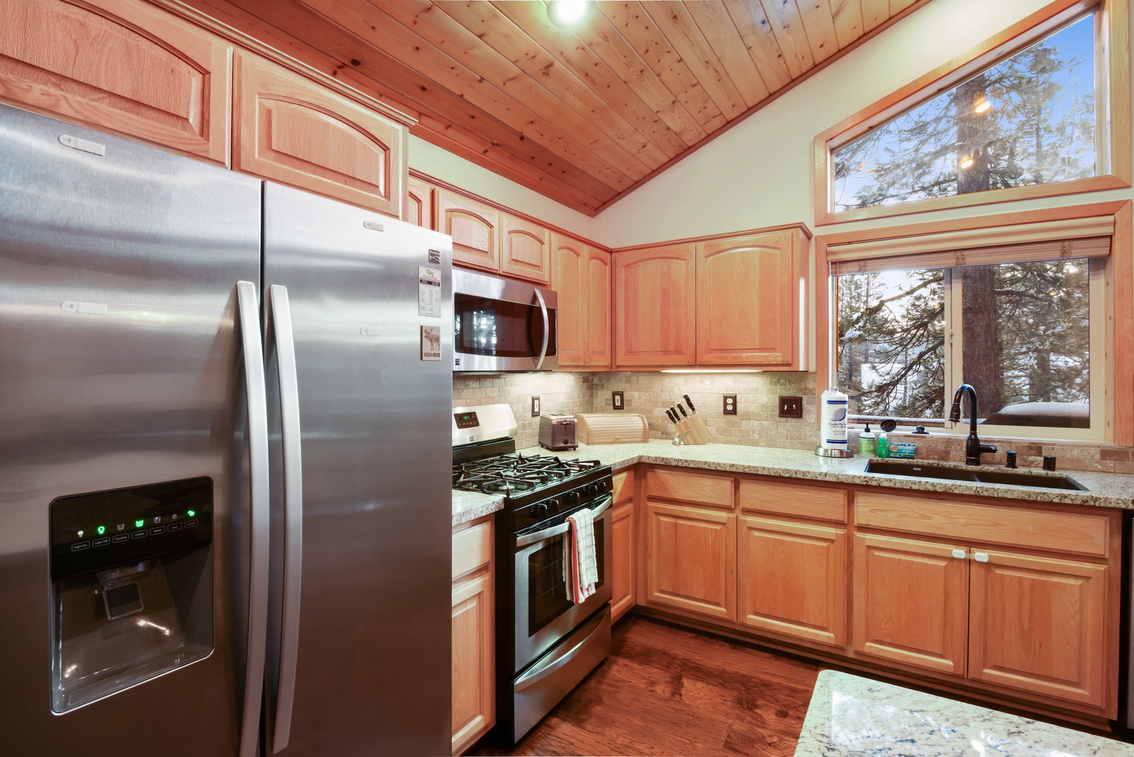 Kitchen with drip coffee pot, toaster, dishwasher, and more