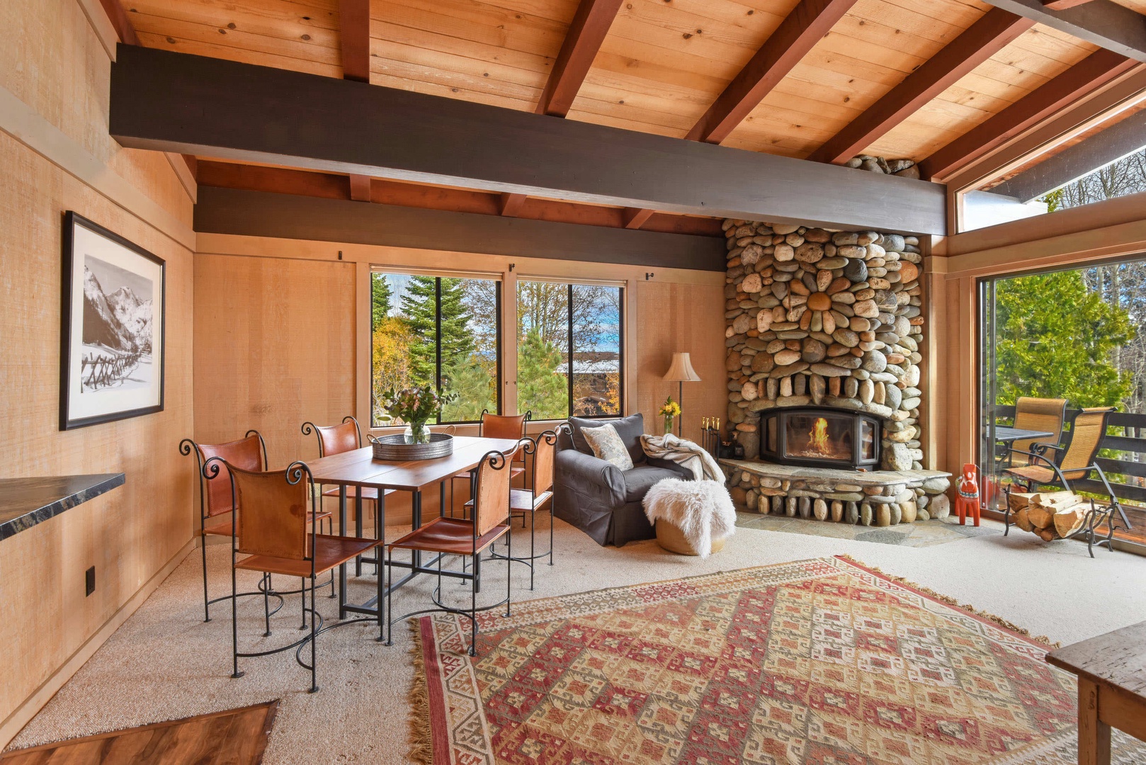Upstairs living area with living room, kitchen, dining table