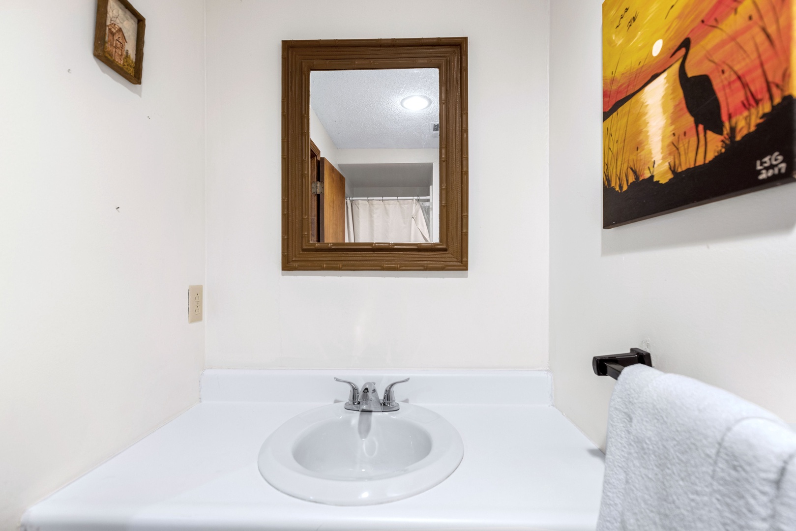 This lower-level full bath features a single vanity & shower