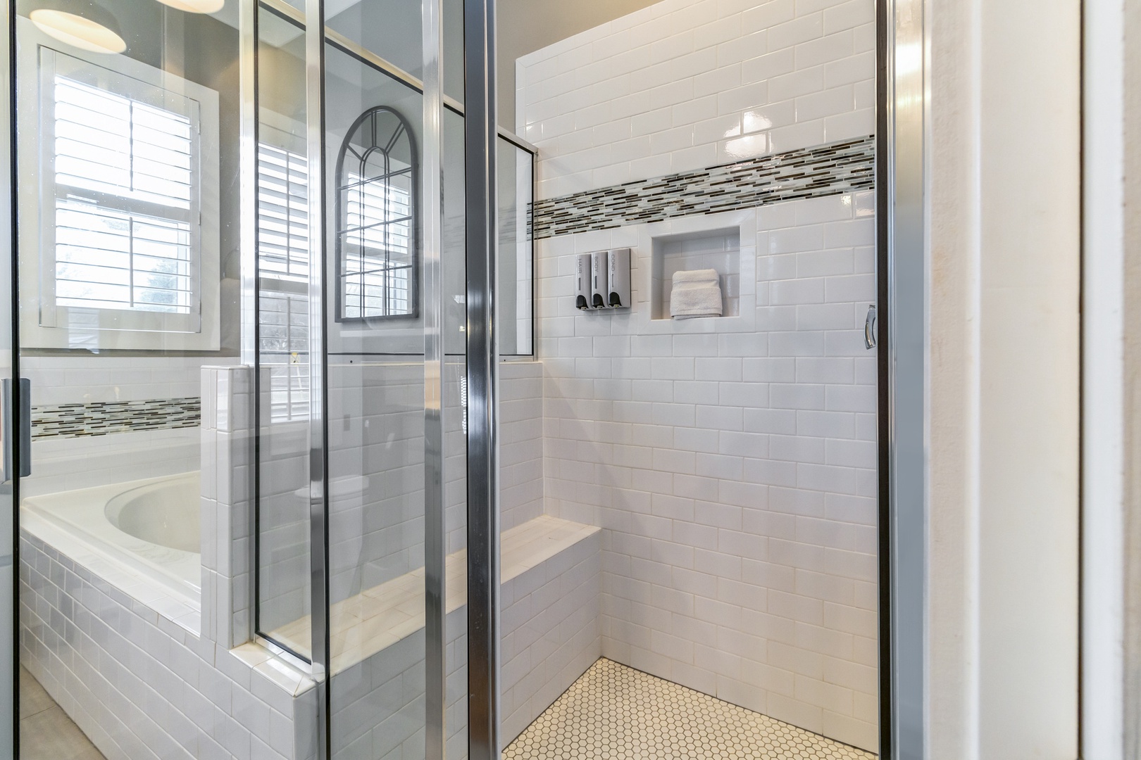 en-suite bathroom with separate shower, and tub