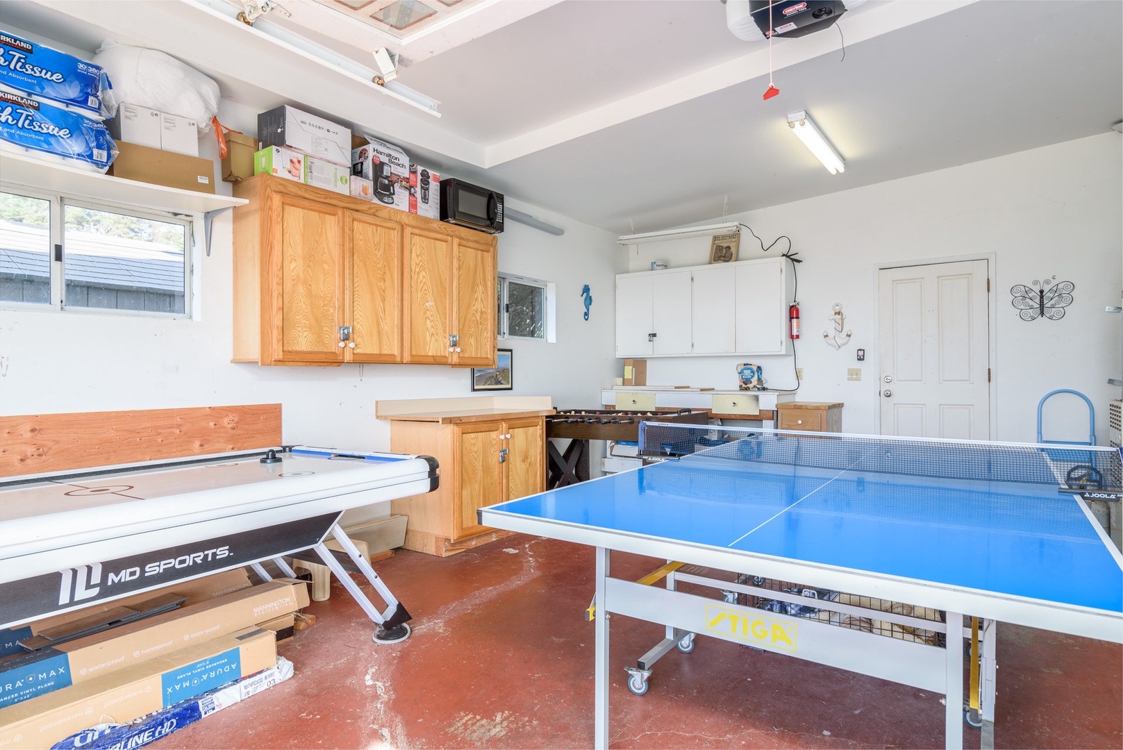 Game room in the garage with ping pong, and air hockey