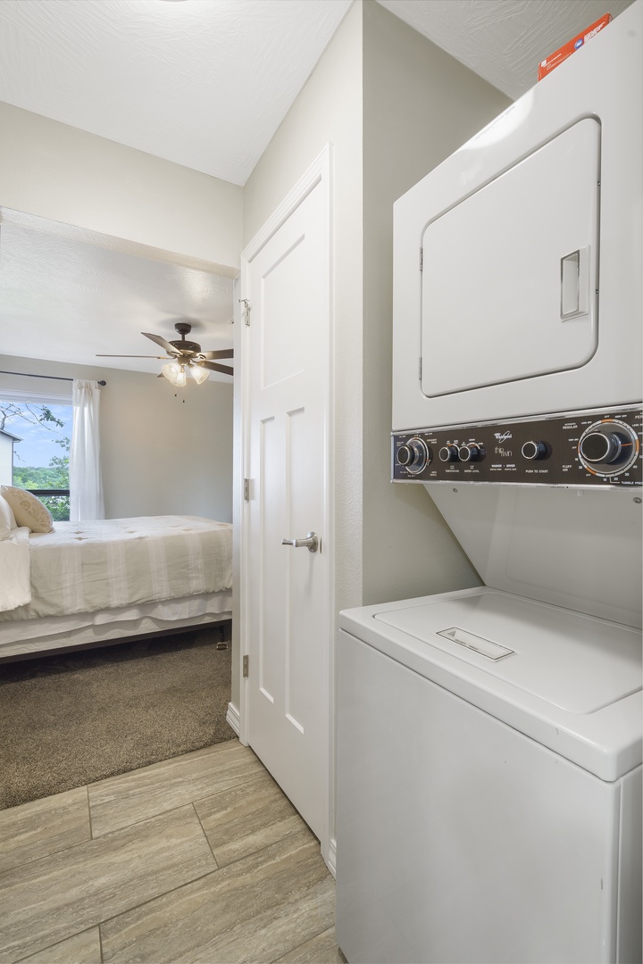 Laundry area between bathroom and bedroom