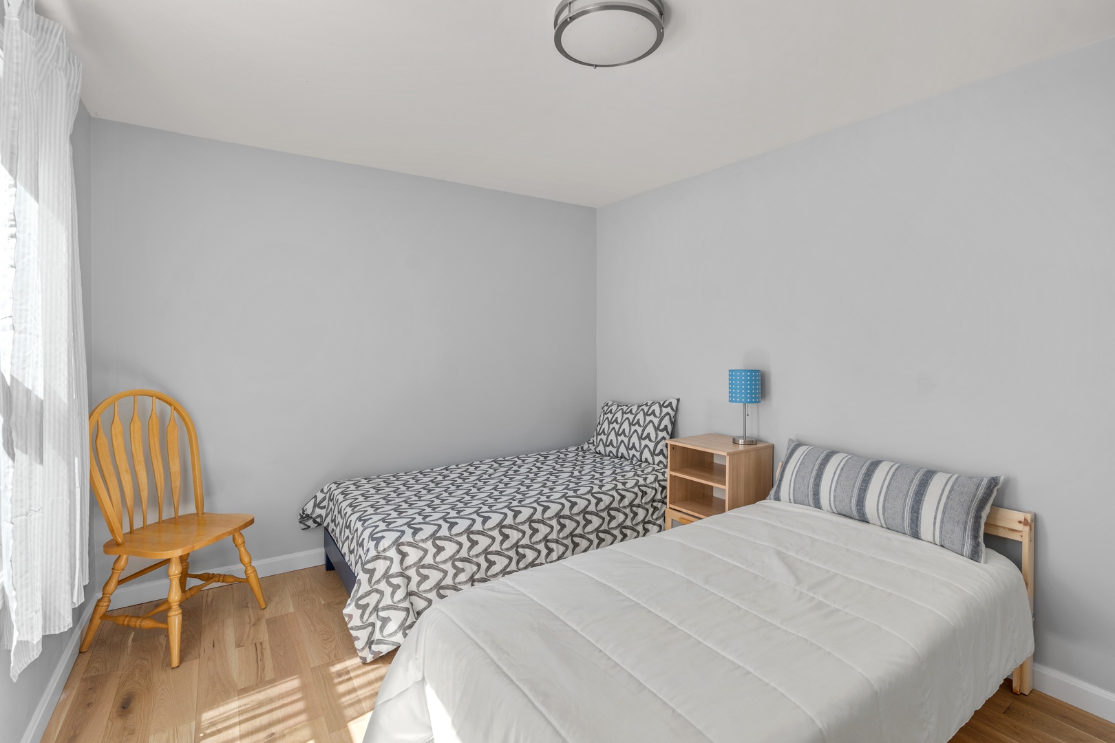 A pair of cozy twin beds is available in this first-floor bedroom