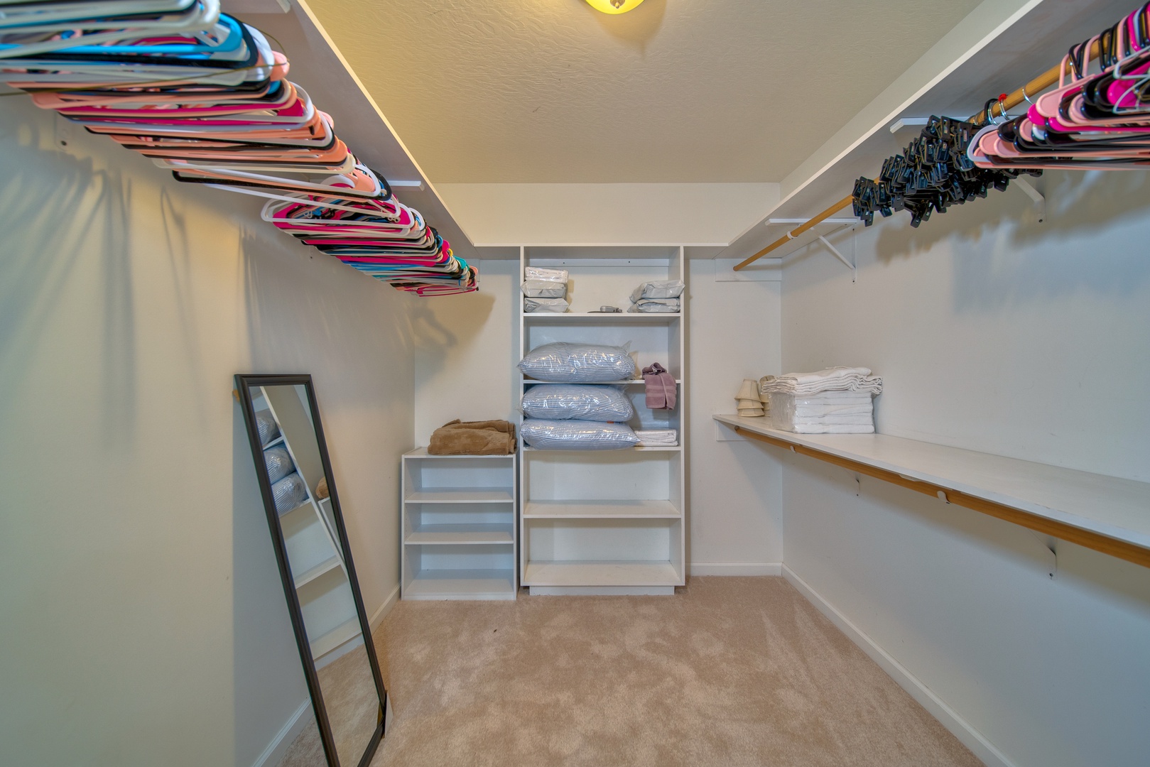 Keep clothes & bags neatly tucked away in the master walk-in closet
