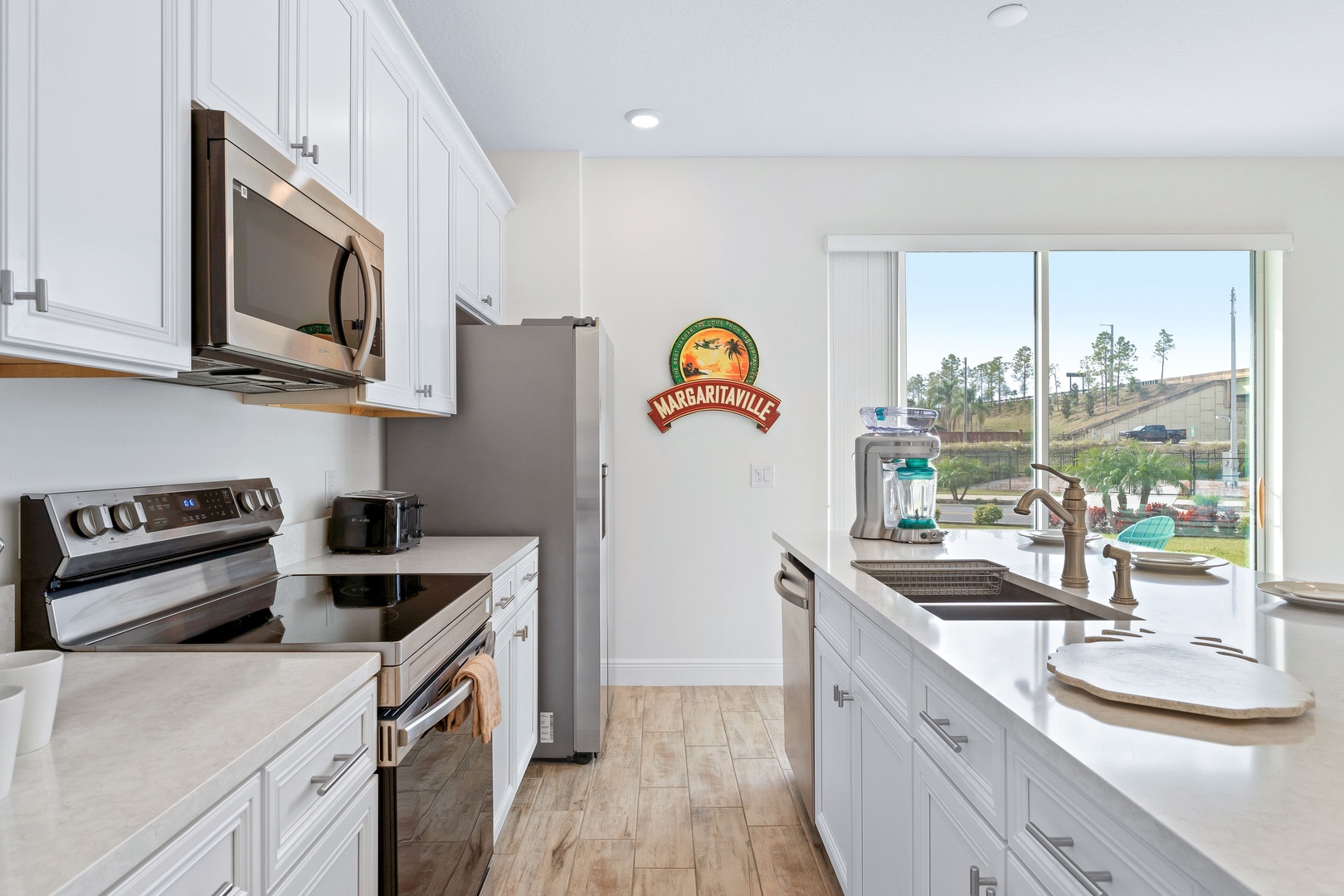 The open, airy kitchen offers ample space & all the comforts of home