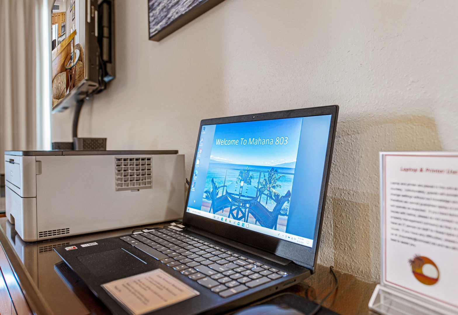 Utilize the provided laptop and printer for your convenience