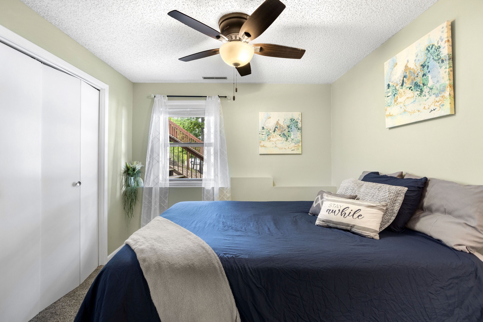 Relax in the second bedroom, including a queen bed & closet space