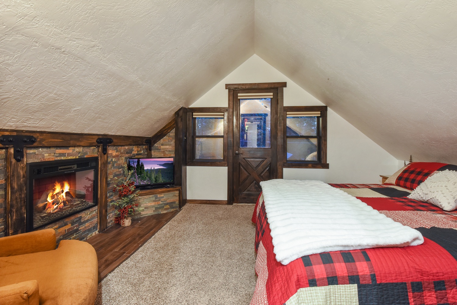 Bedroom 3 with King bed, fireplace, and Smart TV