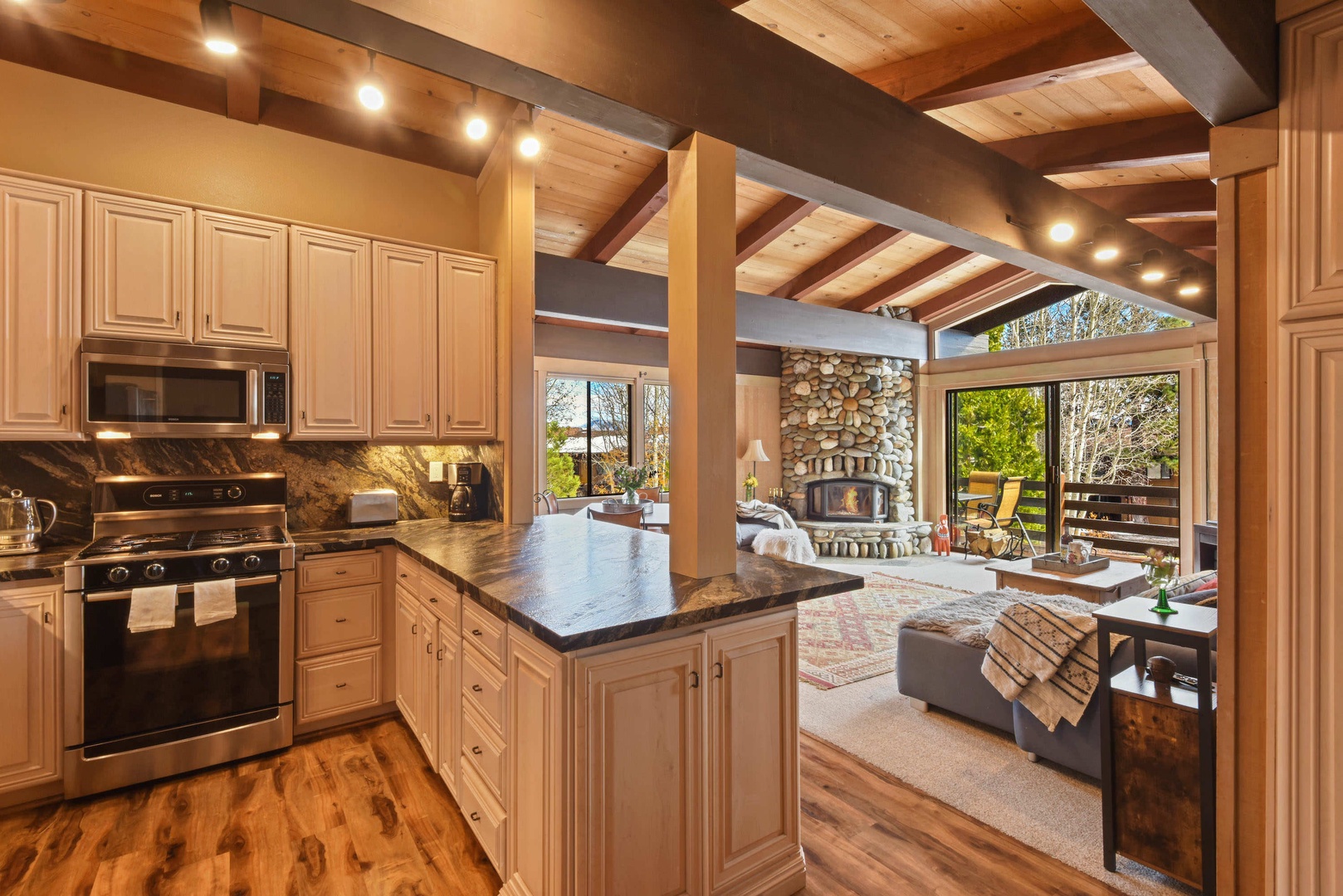 Upstairs living area with living room, kitchen, dining table