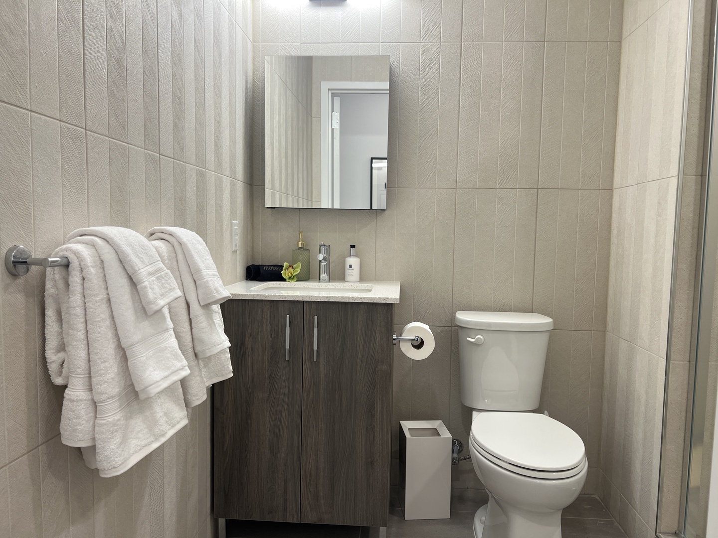 Wash up in the full bath, featuring a single vanity & glass shower