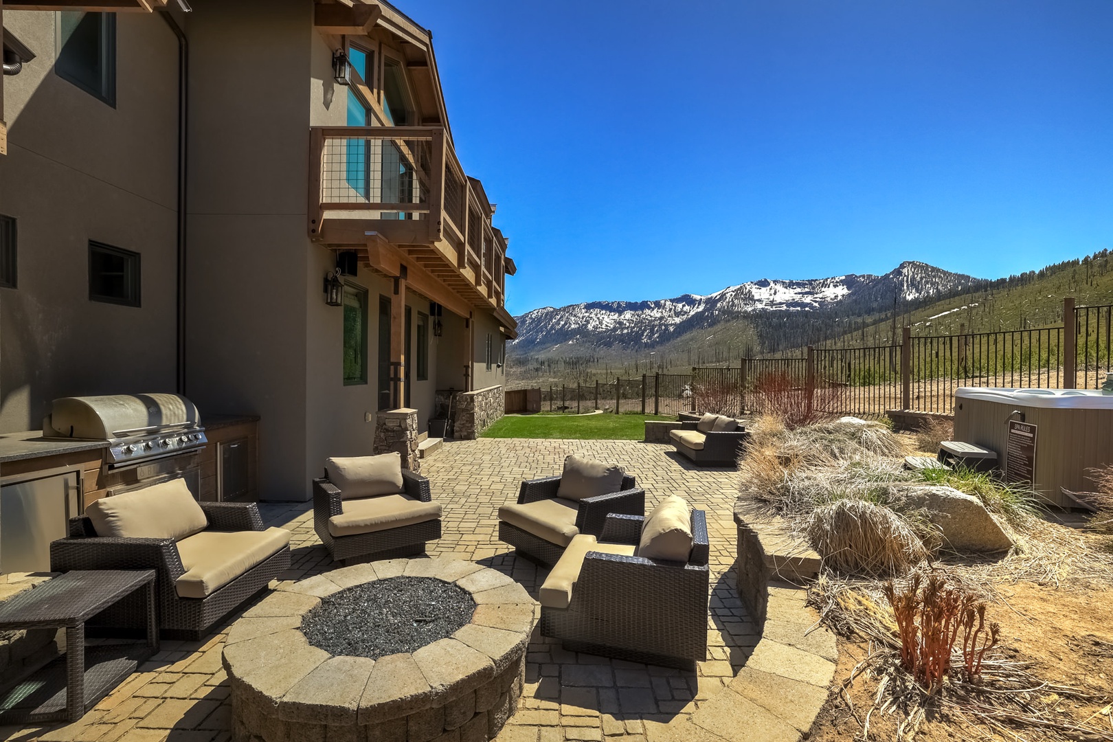 Relax outdoors around the fire pit while enjoying mountain air and gas grill and views