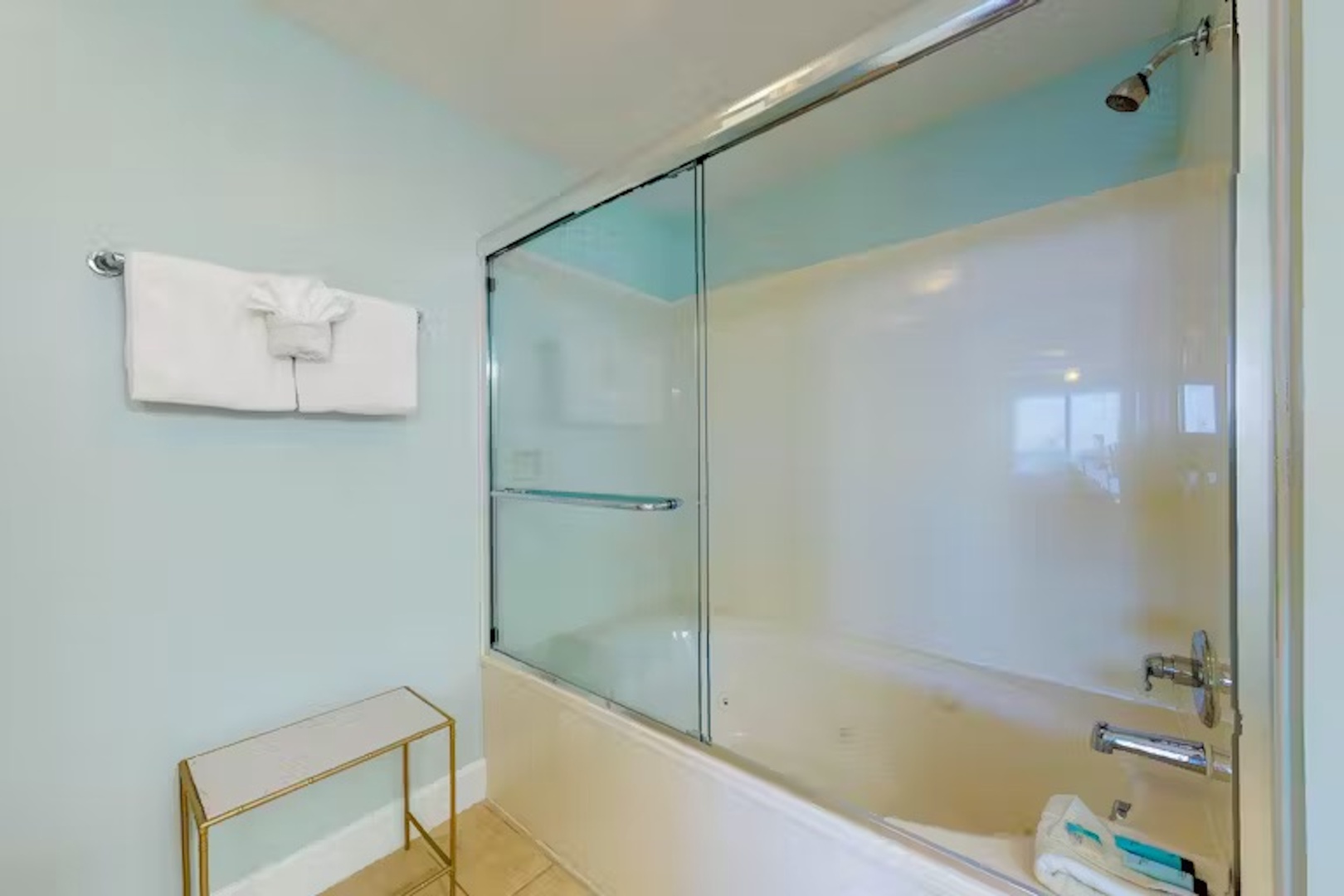 Wash up in the queen ensuite, featuring a double vanity & shower/tub combo