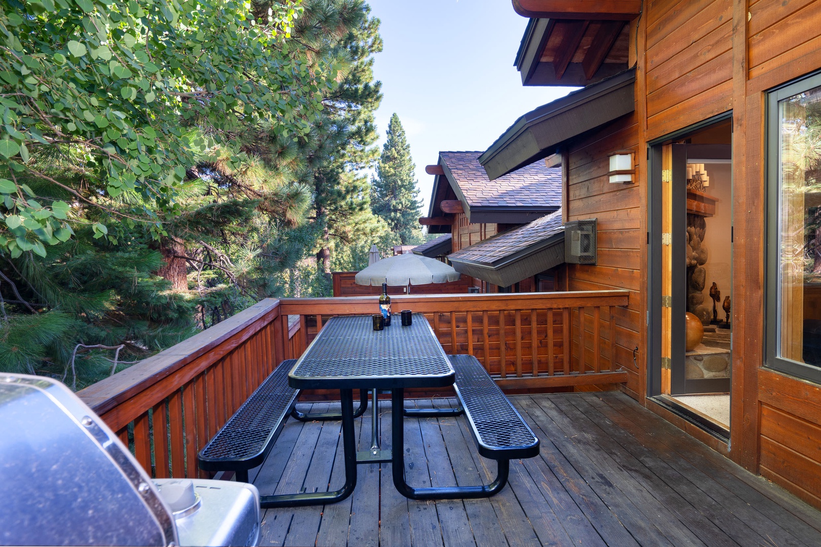 Adorable balcony with gas BBQ grill and seating