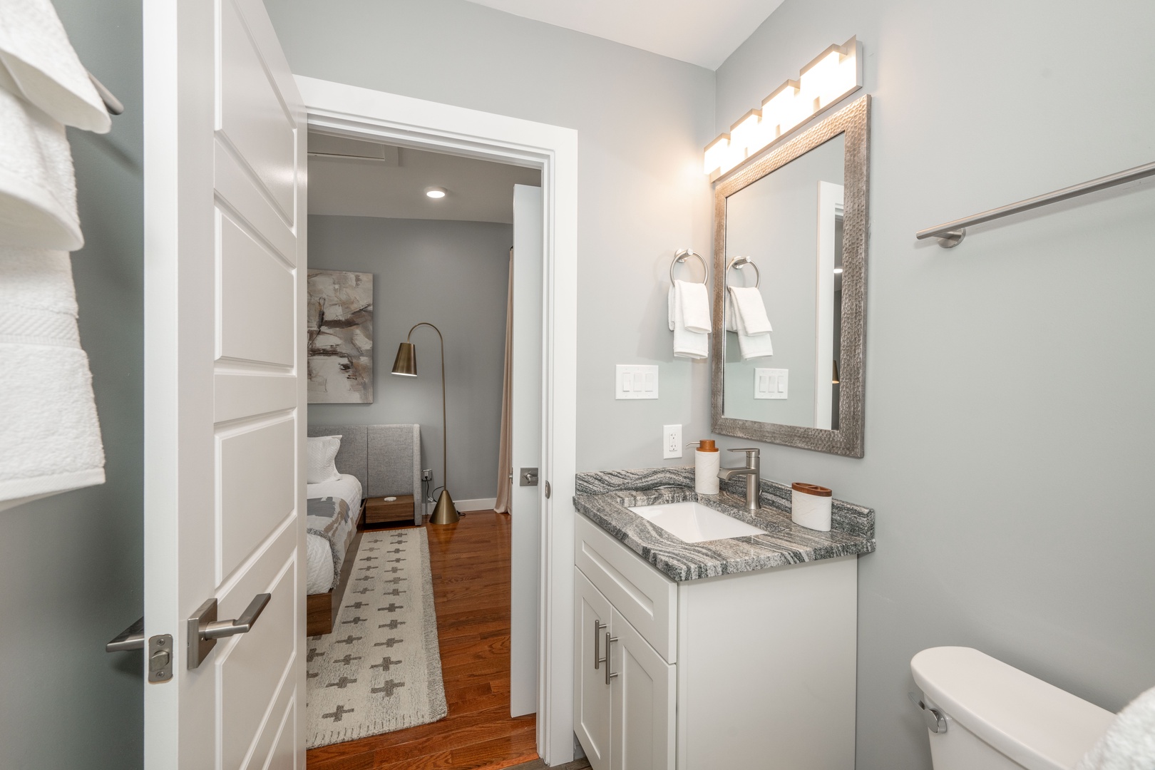 This ensuite bath features a single vanity & glass shower