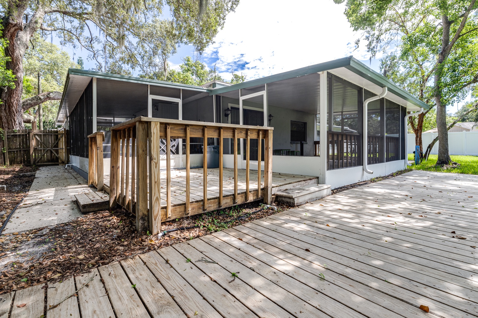 Lounge the day away in the fresh air on the screened porch!