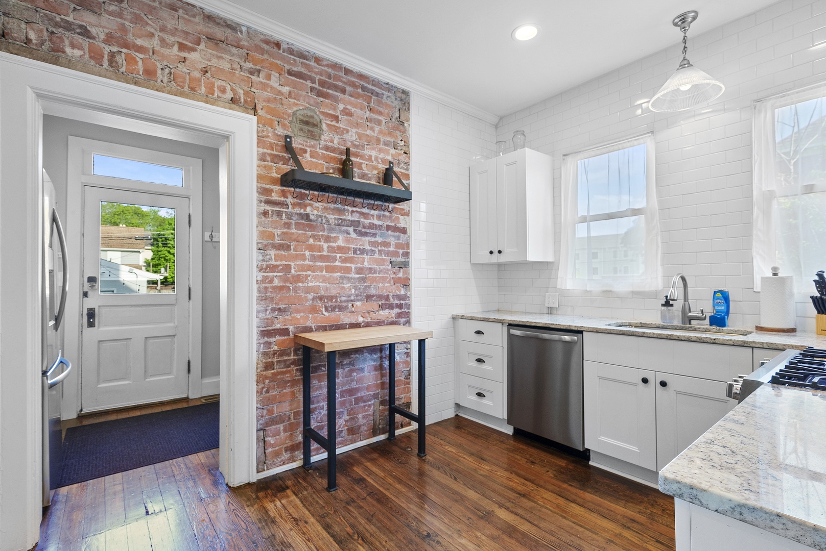 The bright, updated kitchen offers ample space & all the comforts of home