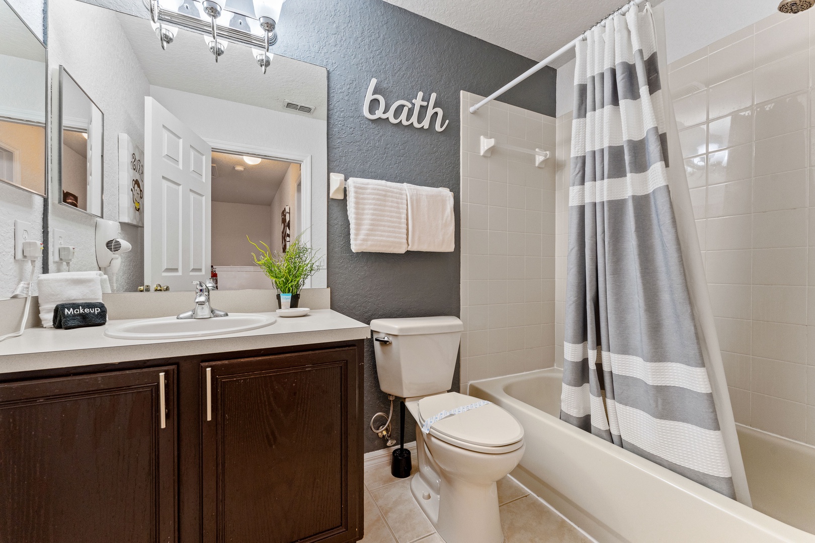 Shared bathroom with shower/tub combo