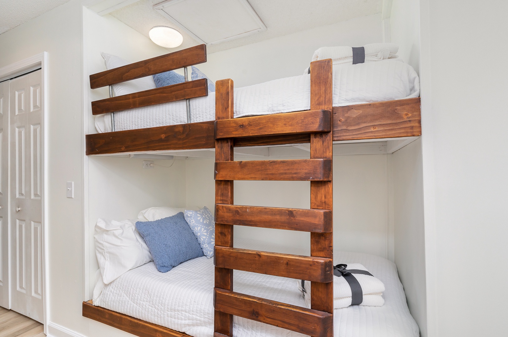 Cozy twin bunks await in the hallway sleeping nook