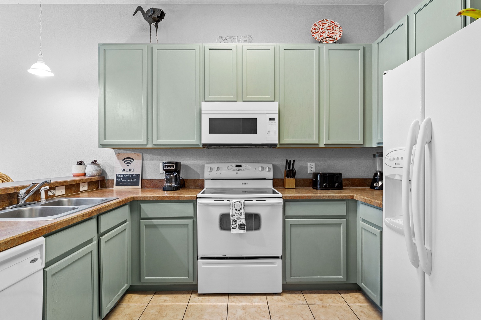 The open, airy kitchen offers ample space & all the comforts of home