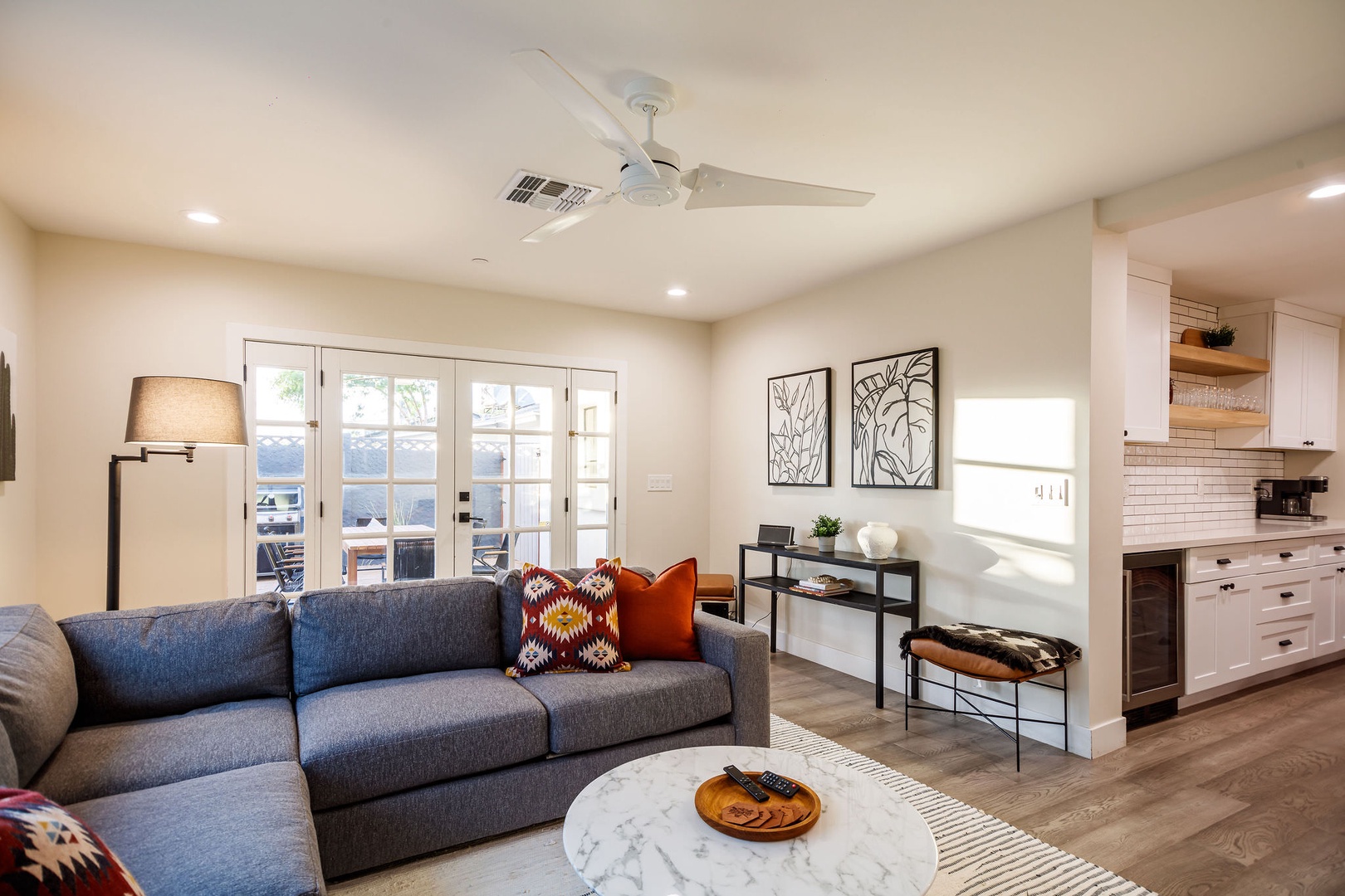 Living room holds easy access to the backyard area