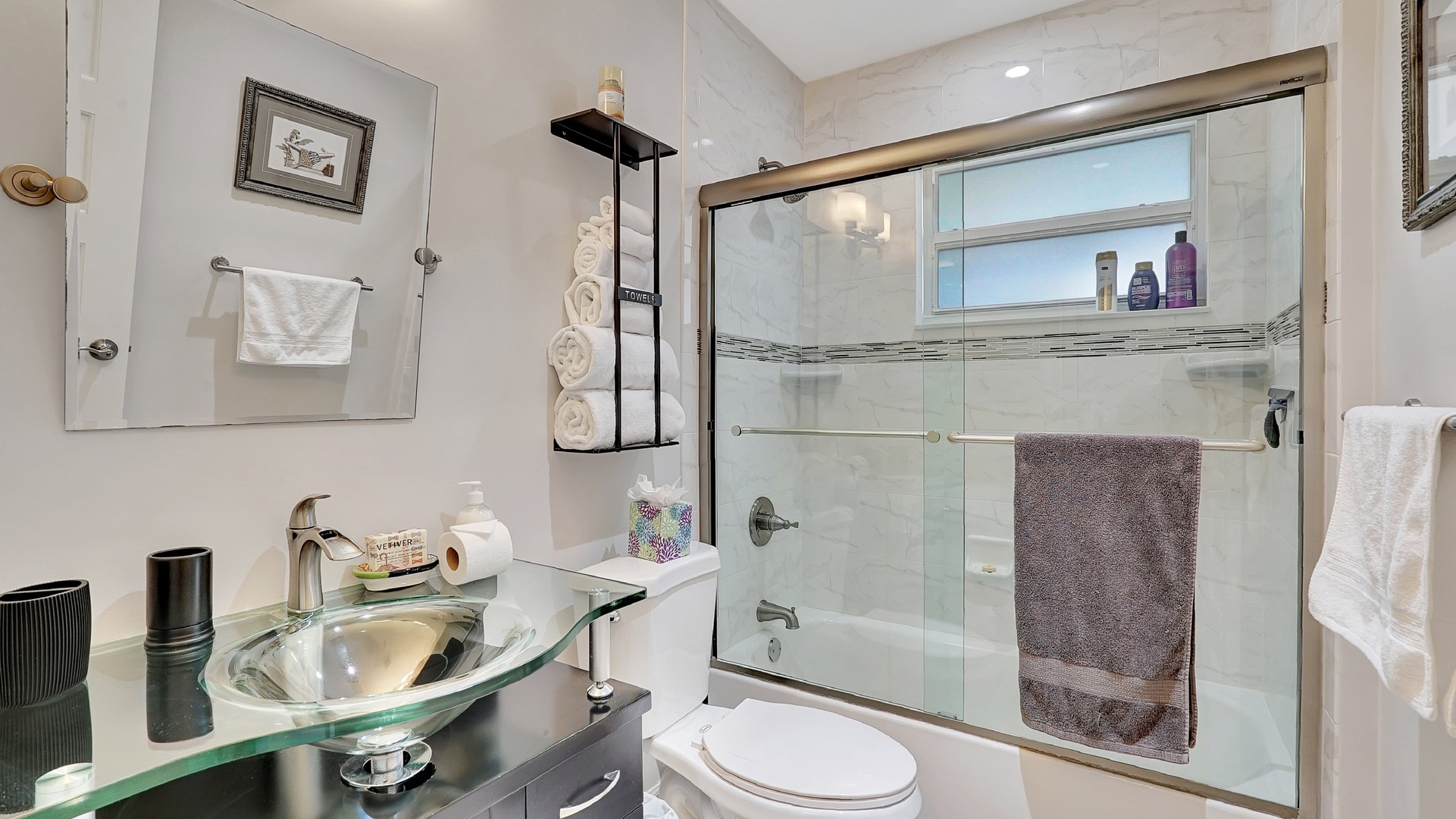 Shared bathroom with shower/tub combo