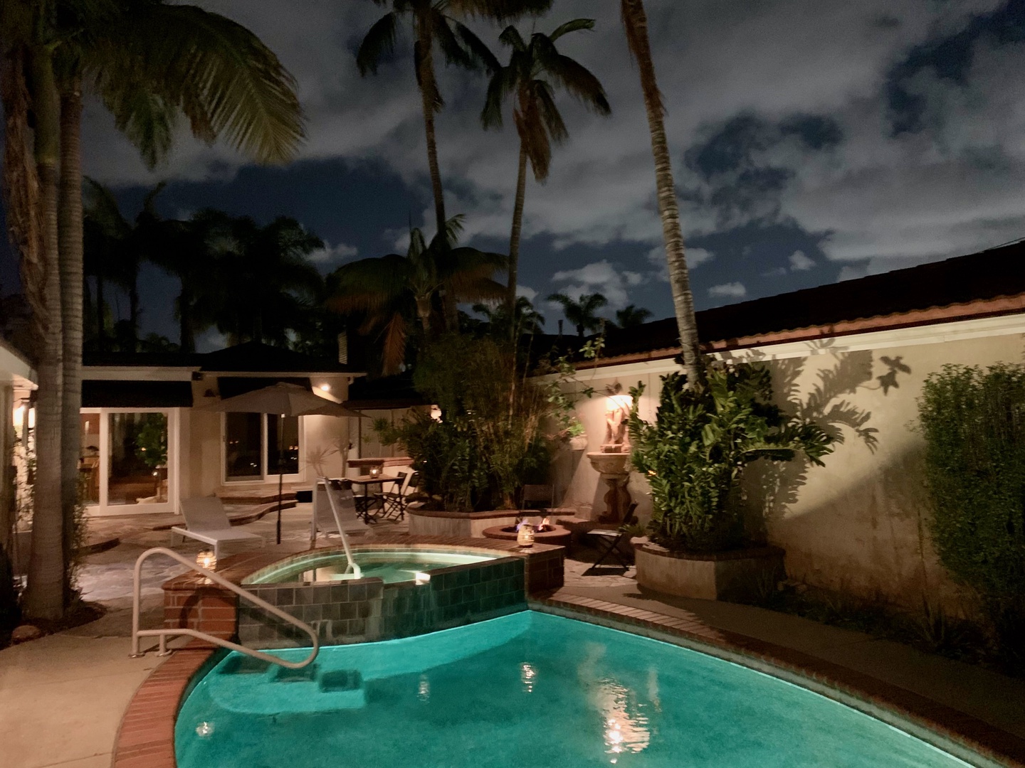 Pool with jacuzzi at night