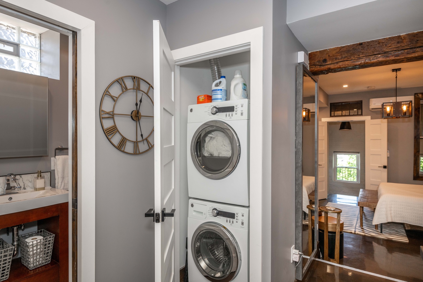 Private laundry is available for your stay, tucked away off the full bath