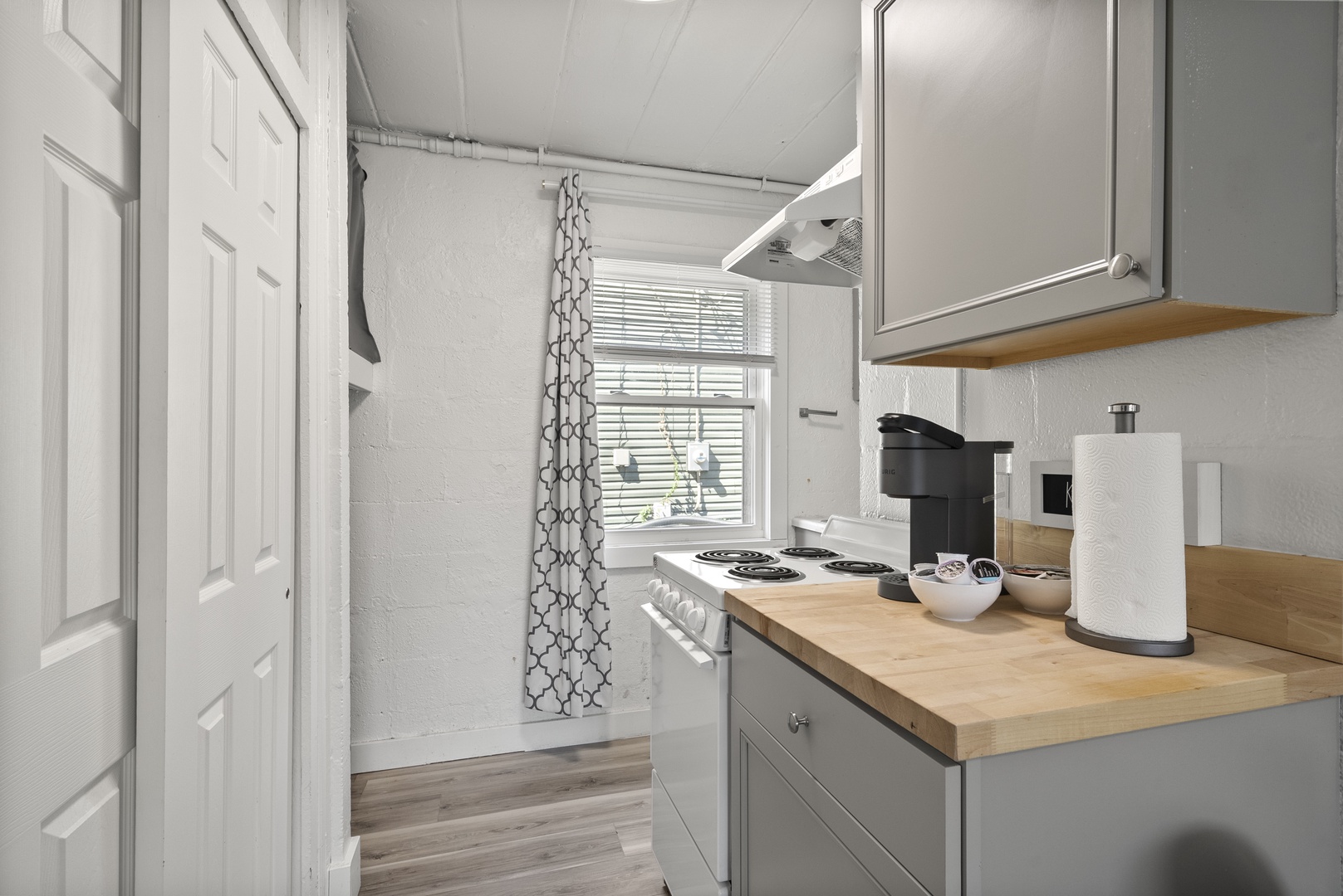 The chic kitchen provides plenty of storage and all the comforts of home