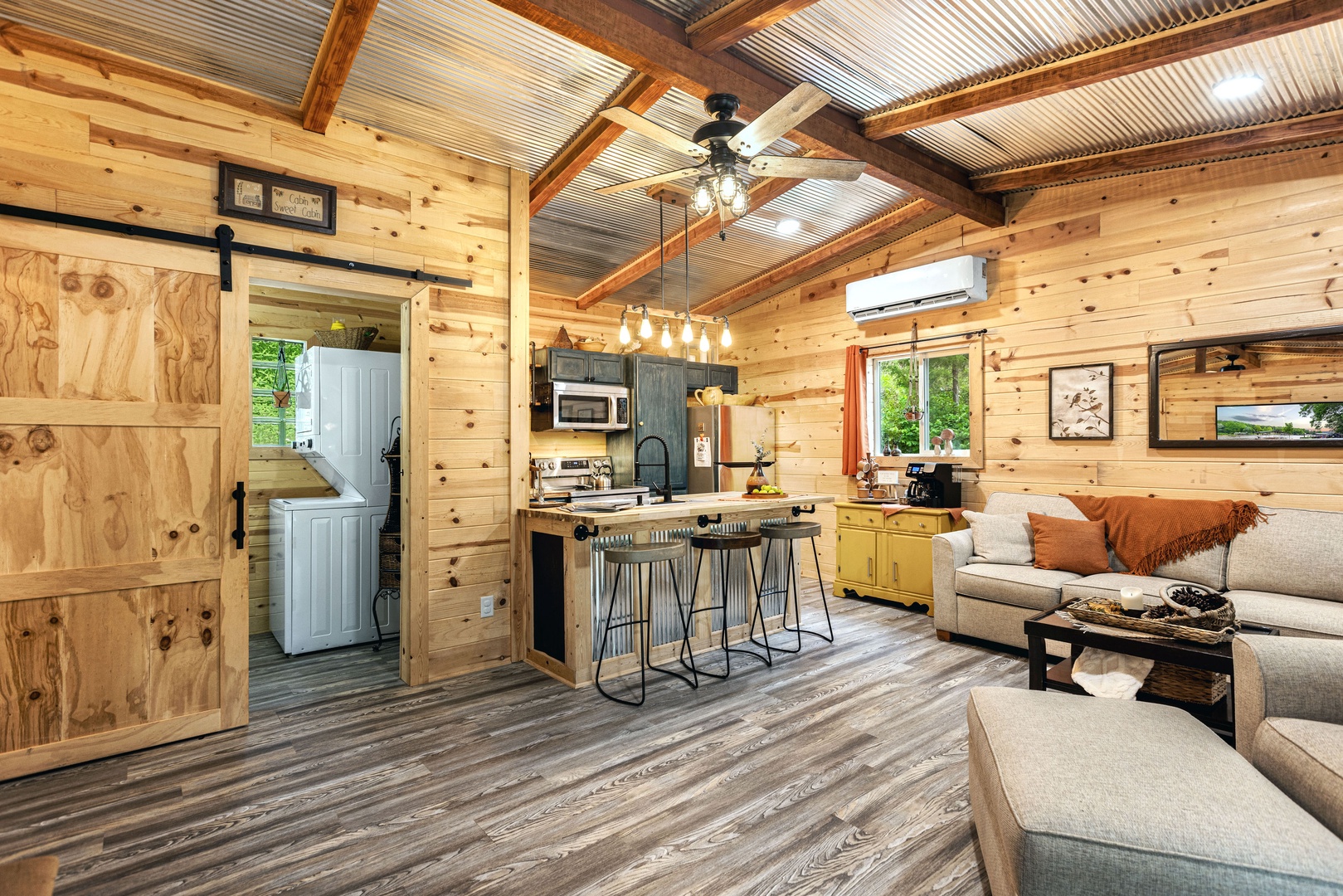 Cozy cabin with an open-concept living room and kitchen, perfect for warm gatherings