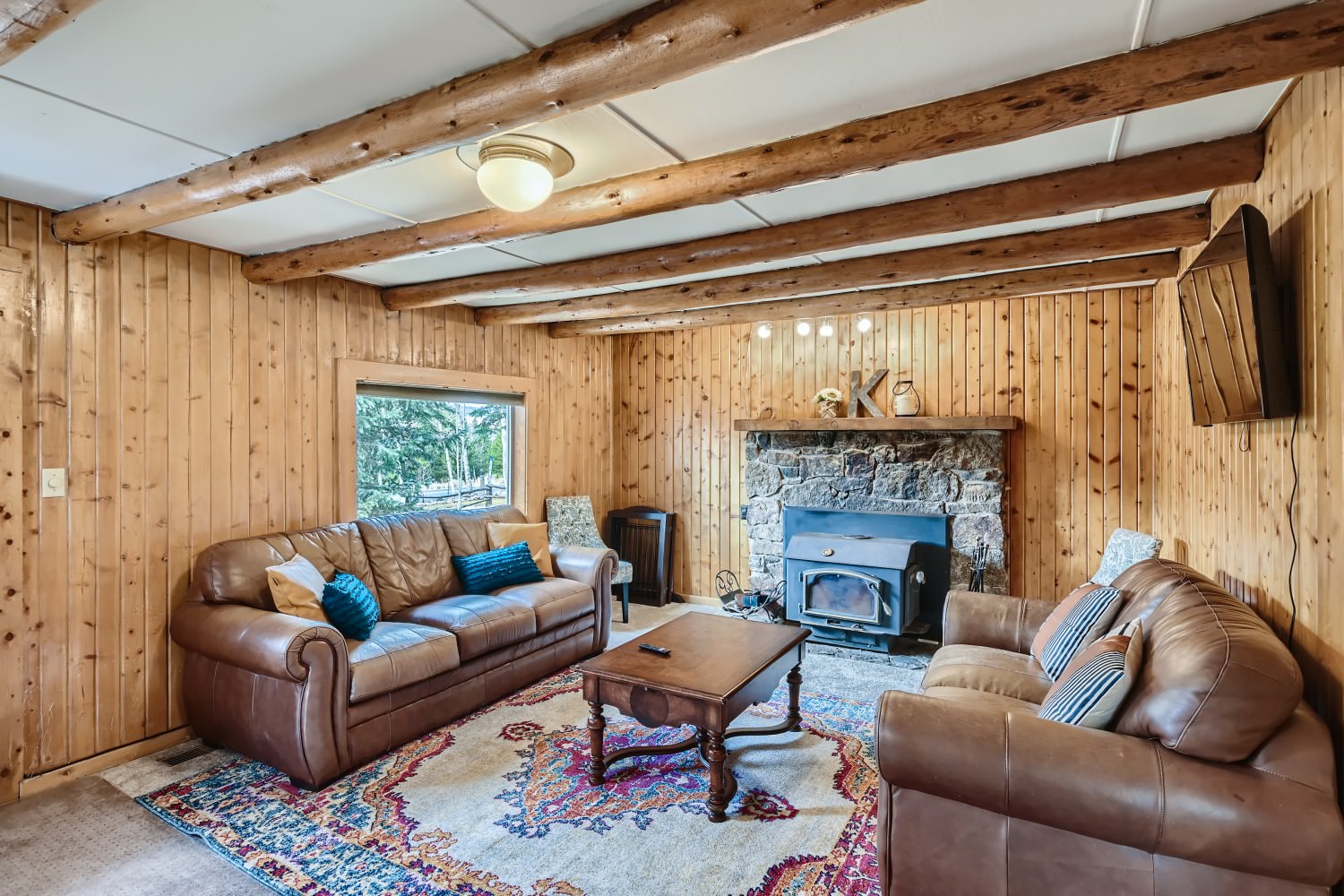 Relax and lounge around the fireplace in the living room