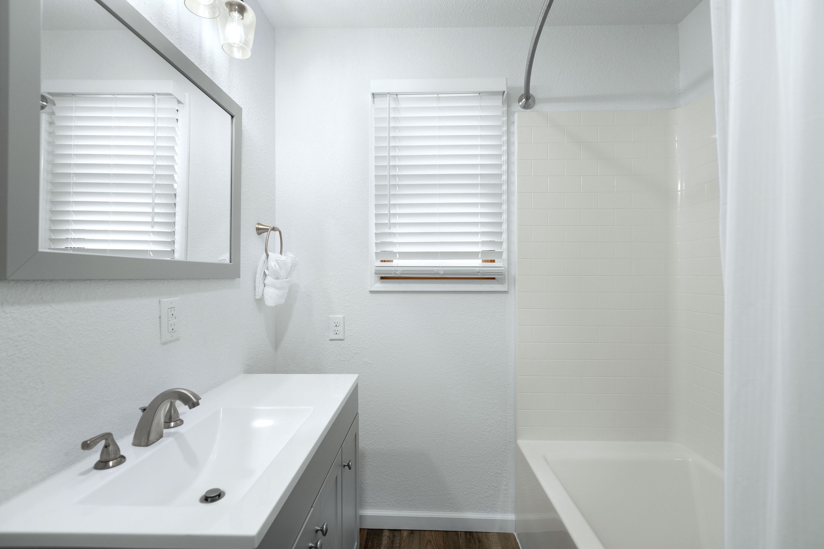 The hall bathroom between bedrooms #1 & #2 offers a single vanity & shower tub combo