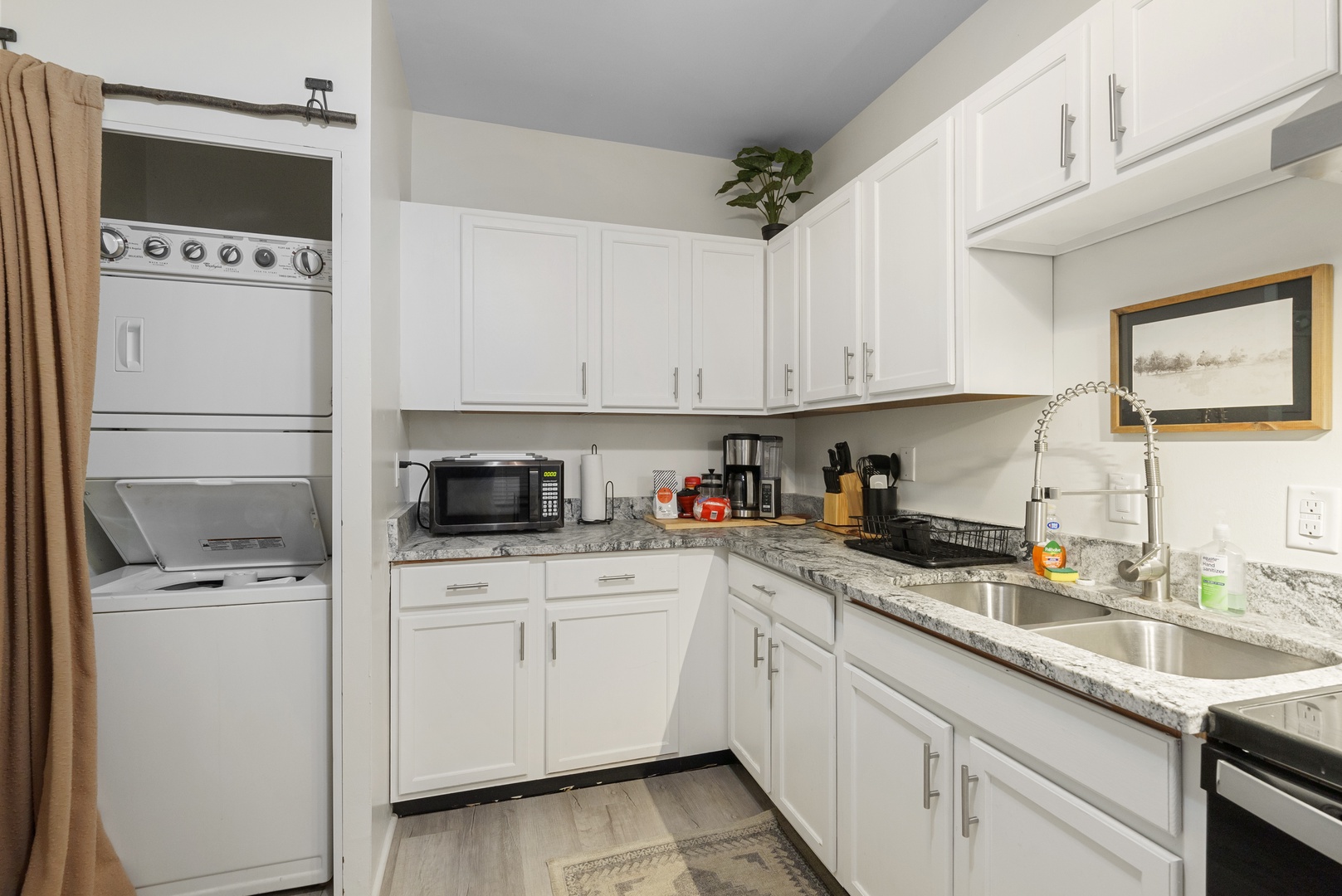 The breezy kitchen offers ample storage & all the comforts of home