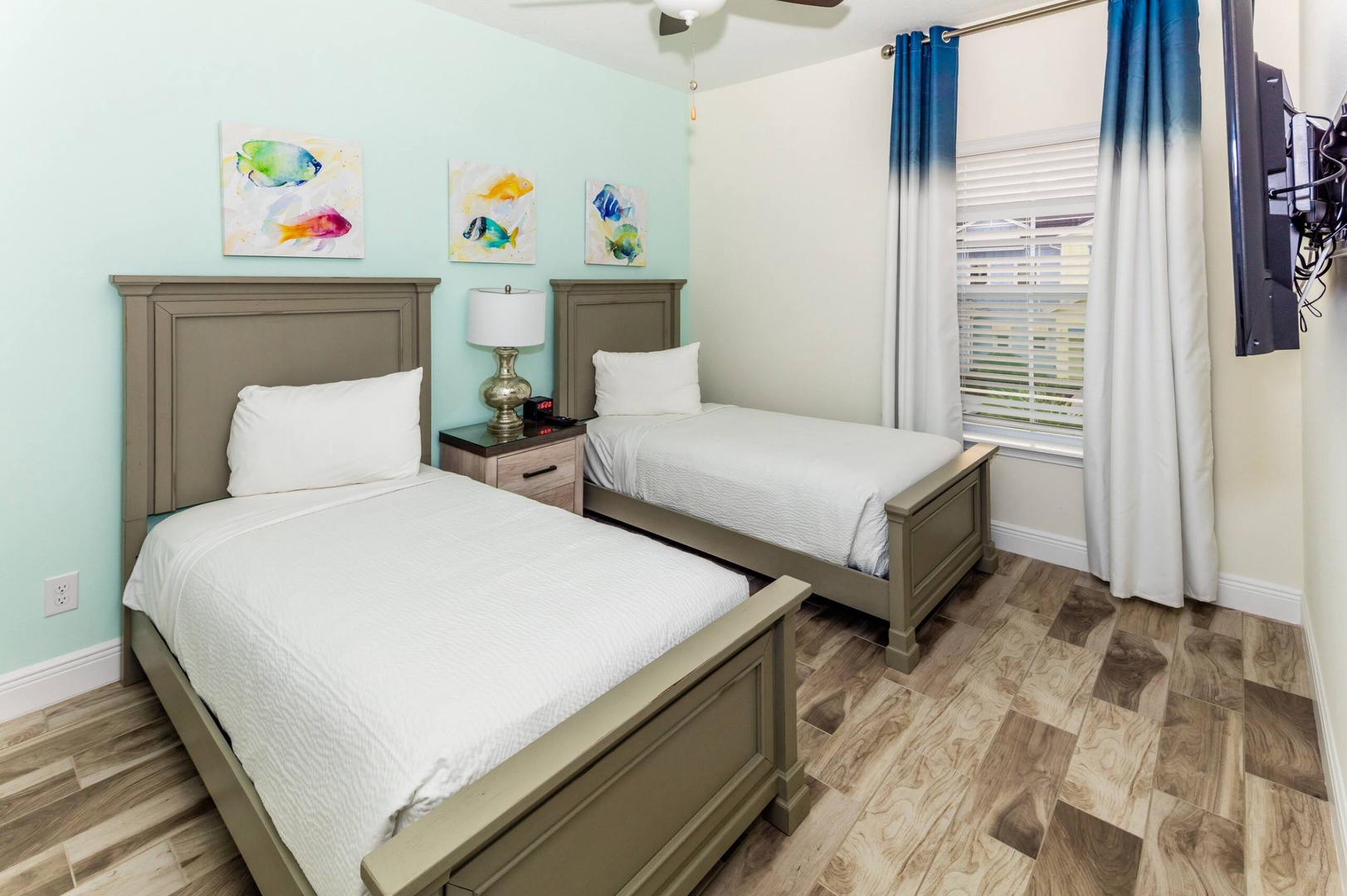 The bedroom retreat offers two plush twin beds & smart TV