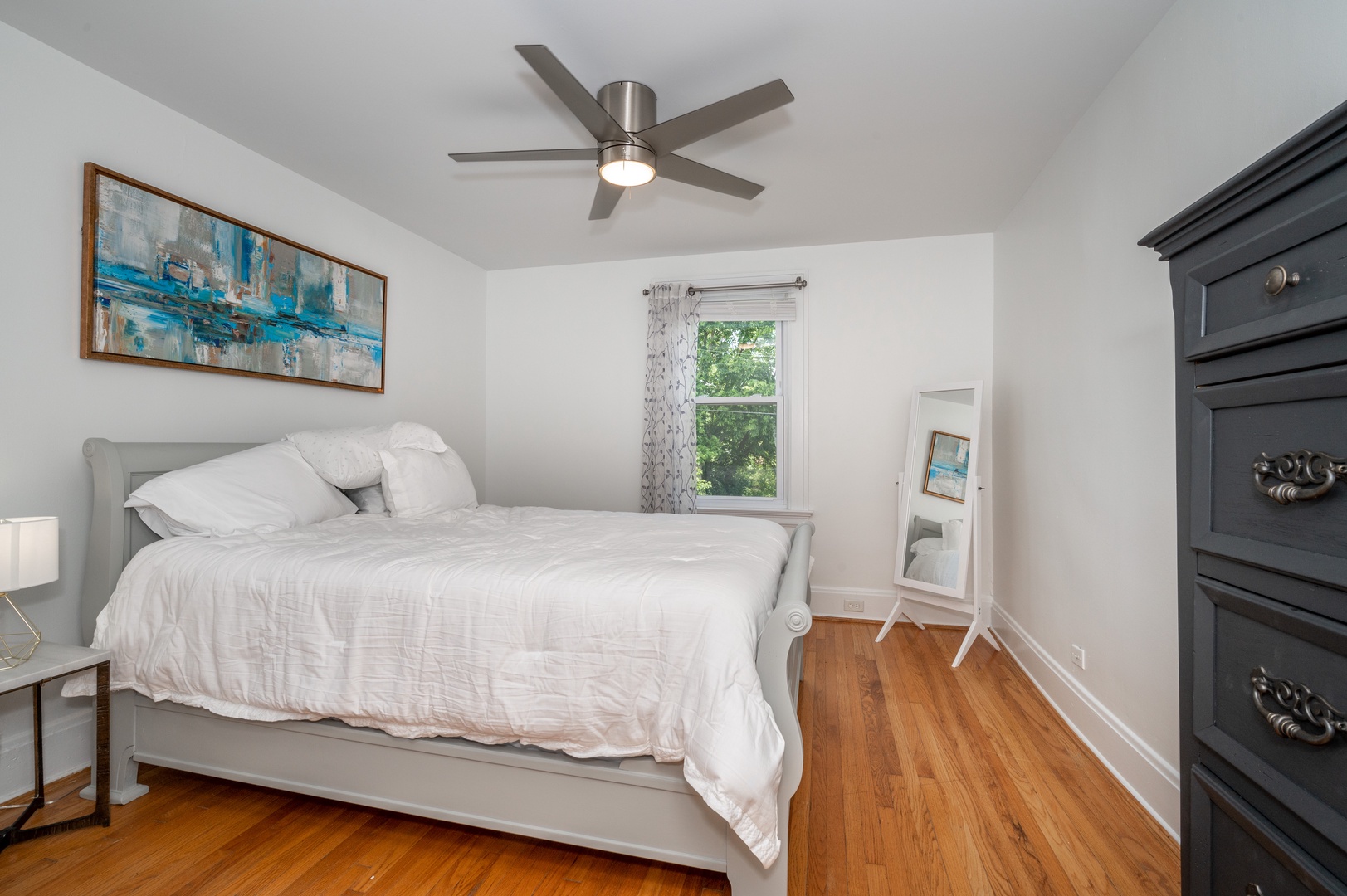 Unit 2 - The 1st of 3 bedrooms, offering a regal queen bed & ceiling fan