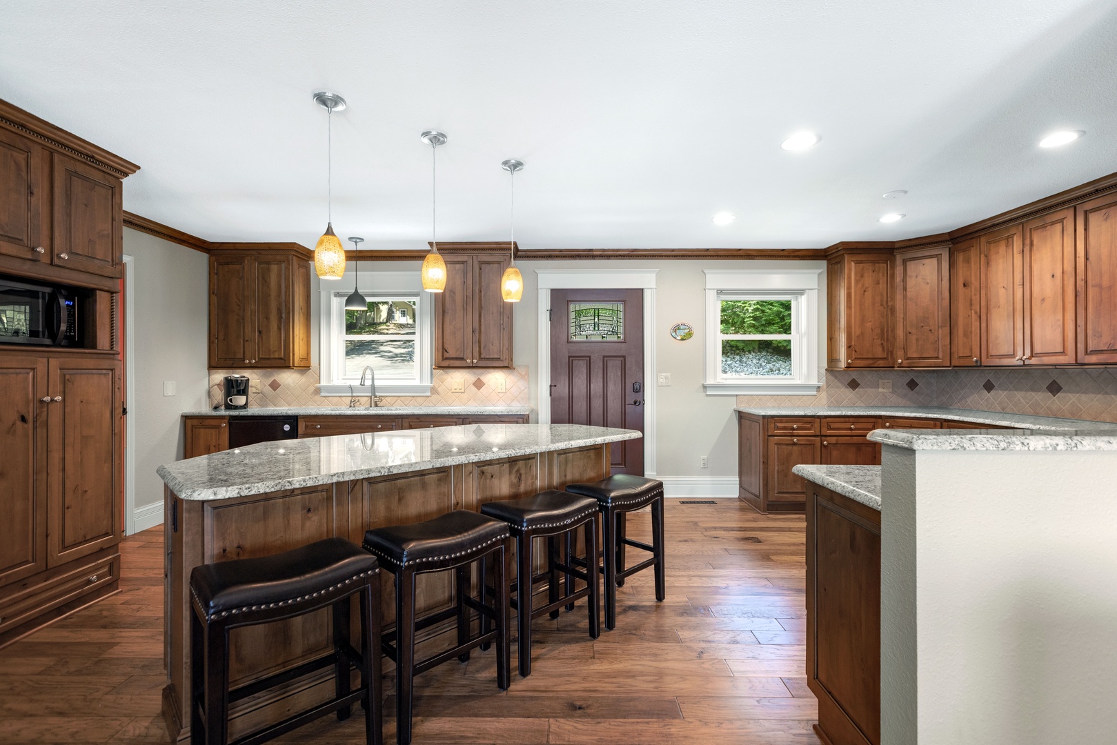 The main house’s chic kitchen offers ample space for the whole crew