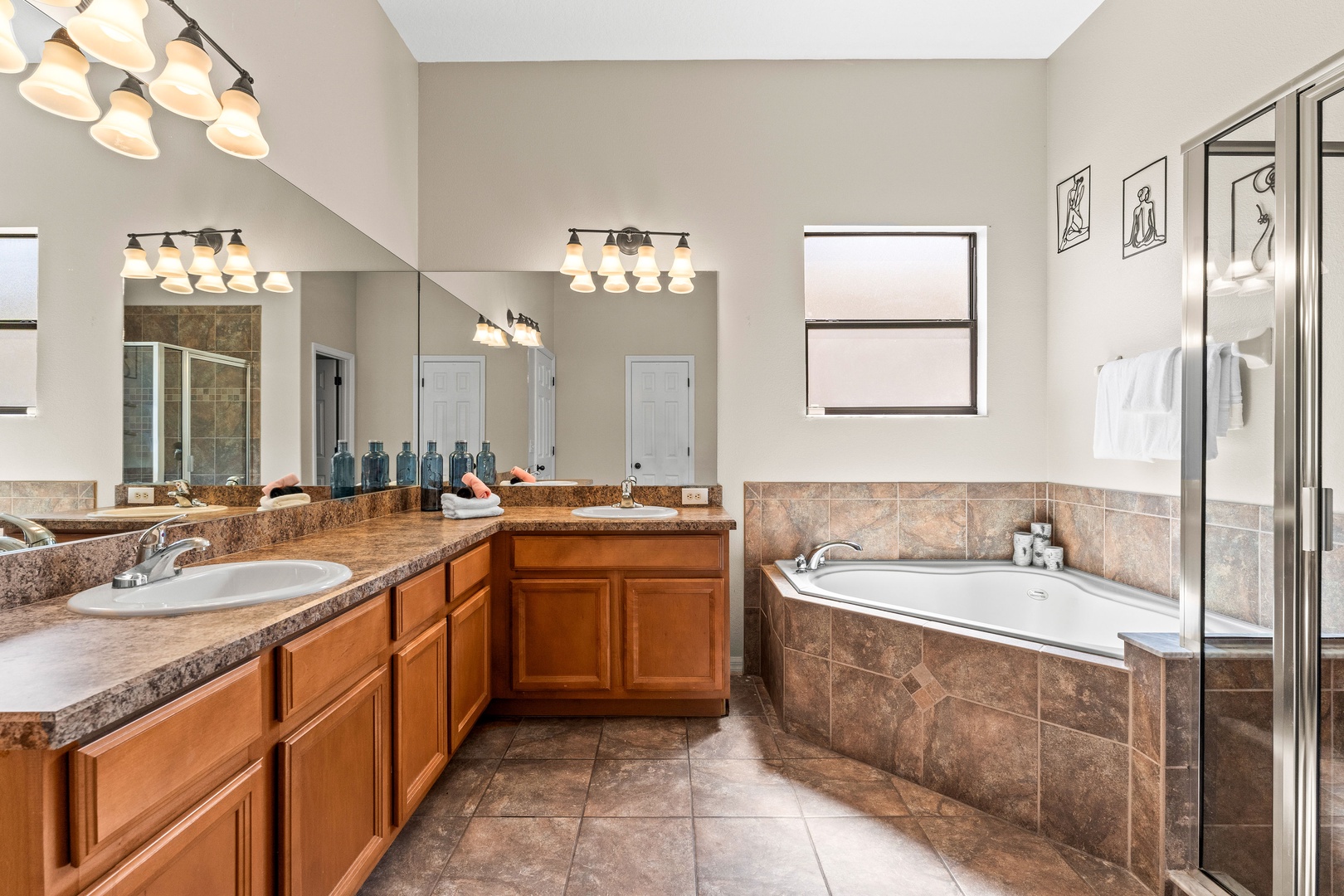 Spacious ensuite with separate soaking tub and glass-enclosed shower