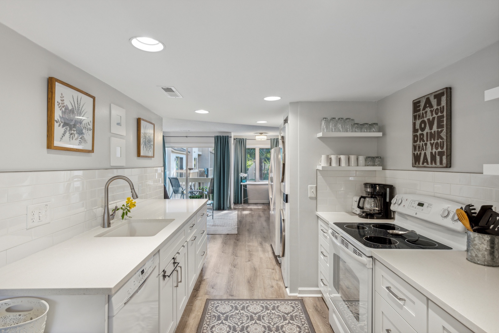 This open, modern kitchen has ample space & all the comforts of home