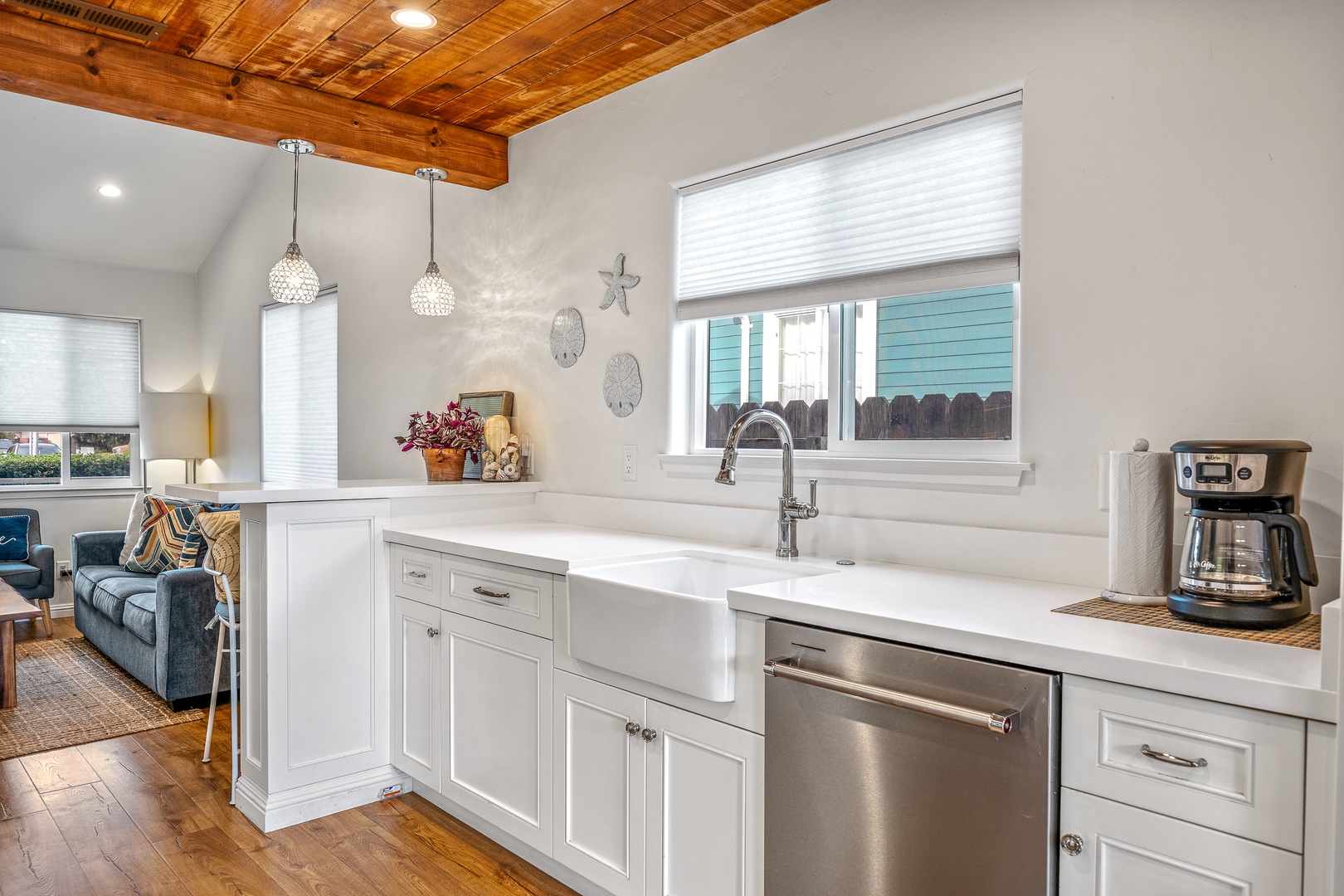 The gleaming coastal kitchen is spacious & offers all the comforts of home