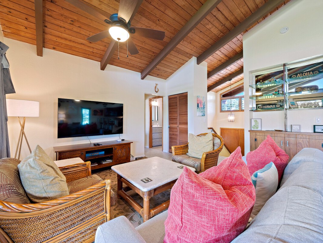 Open living space with ample seating, lanai, and Smart TV