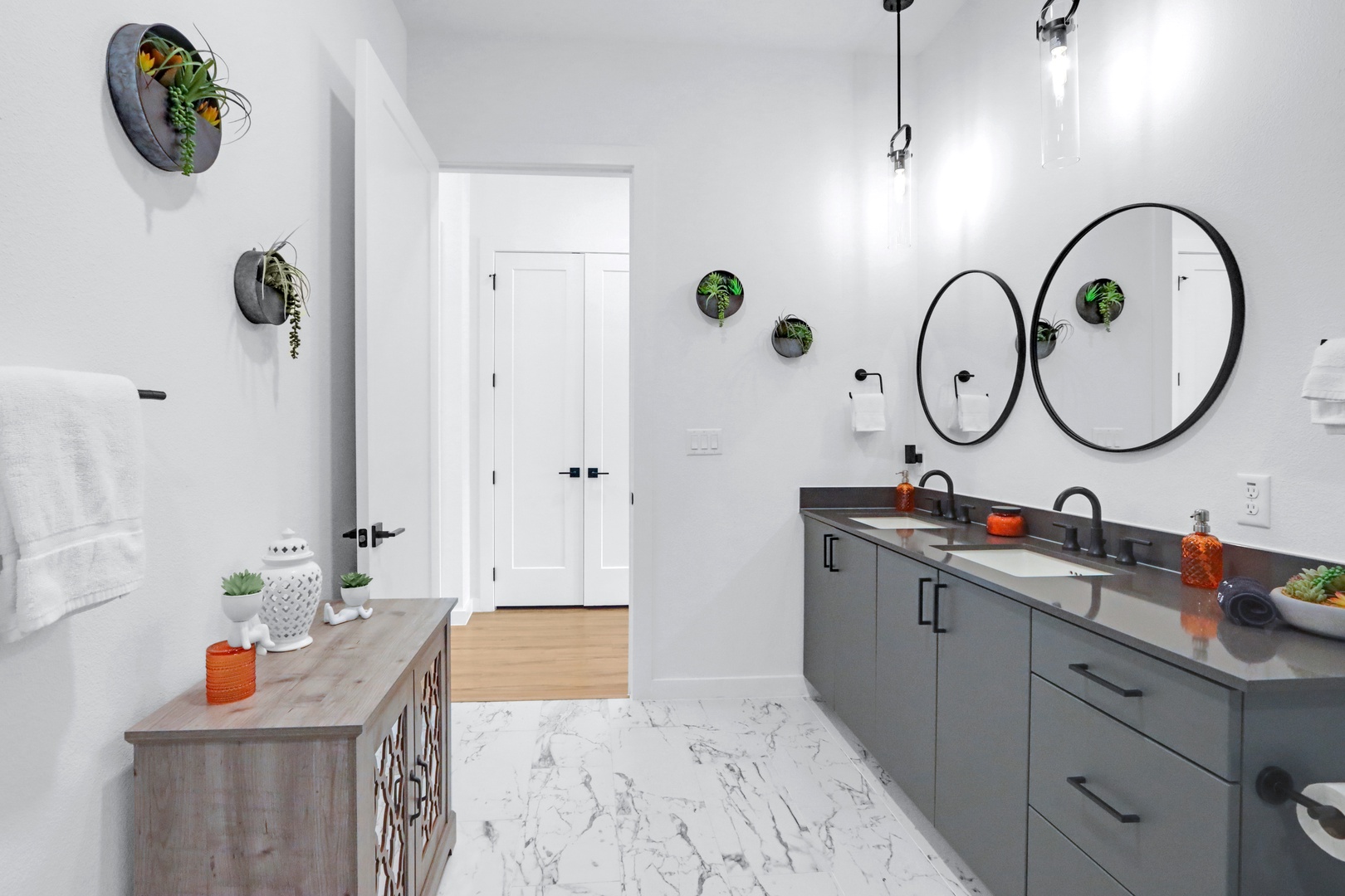 Private dual vanity areas & a glass walk-in shower