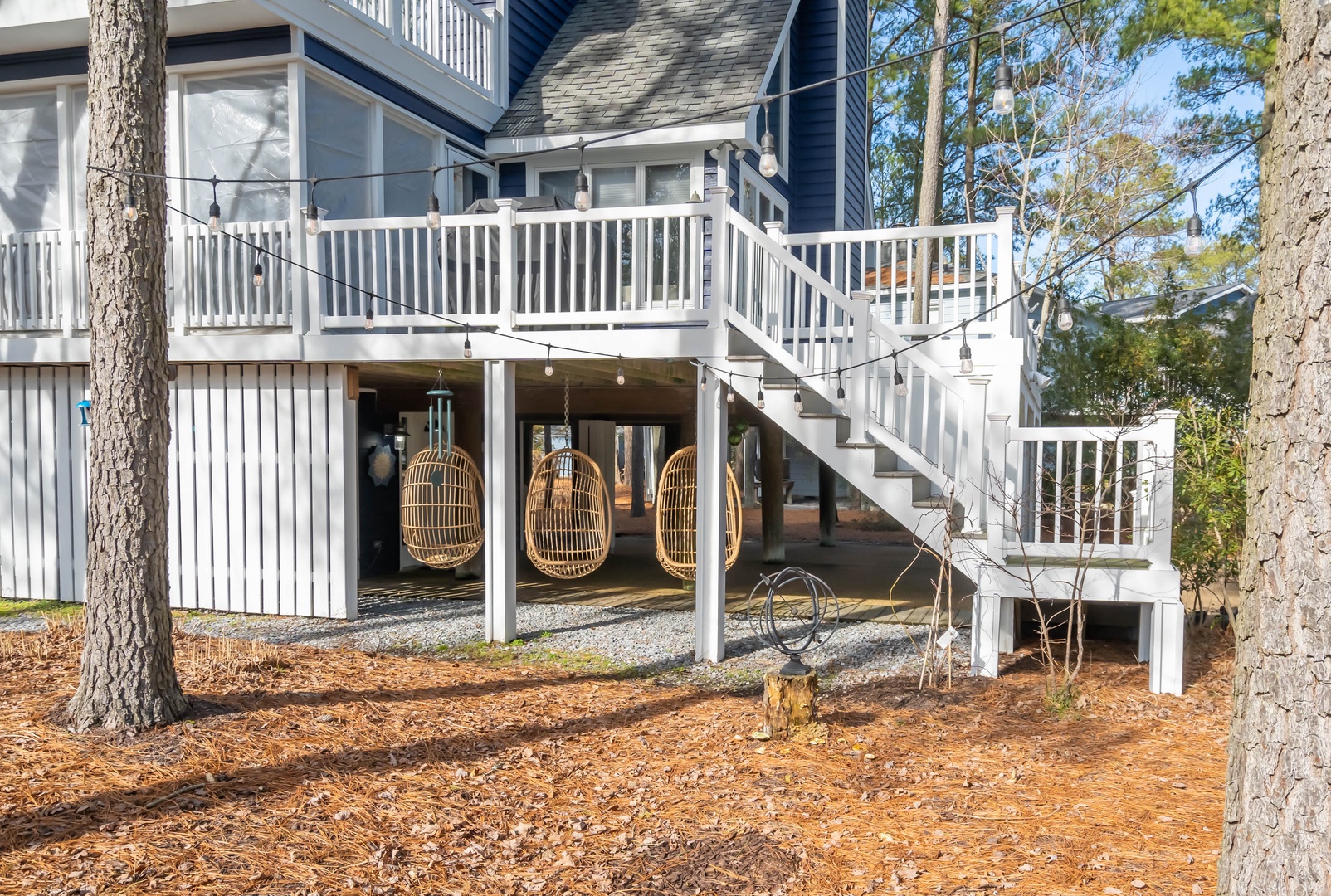 Hanging egg chairs under the porch