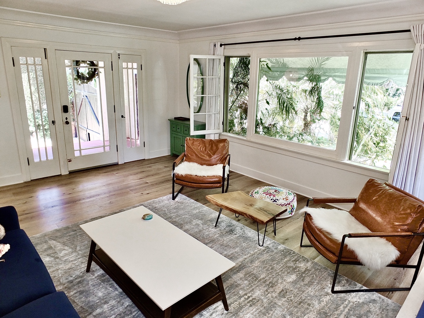 Bright living room with ample seating and Smart TV