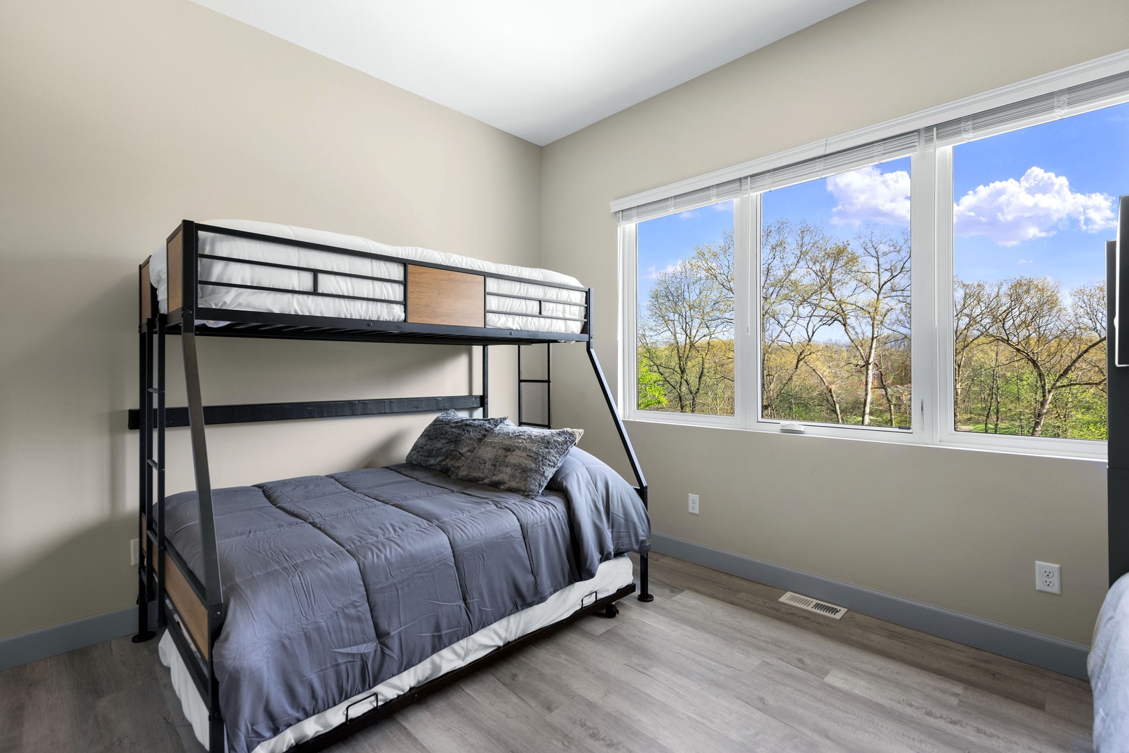 The fourth bedroom features 2 bunk beds and twin trundle