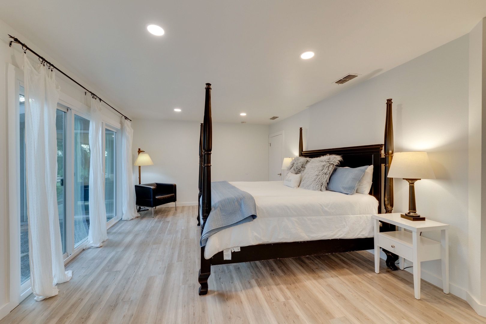 The master king suite offers stunning views, private en suite, & patio access